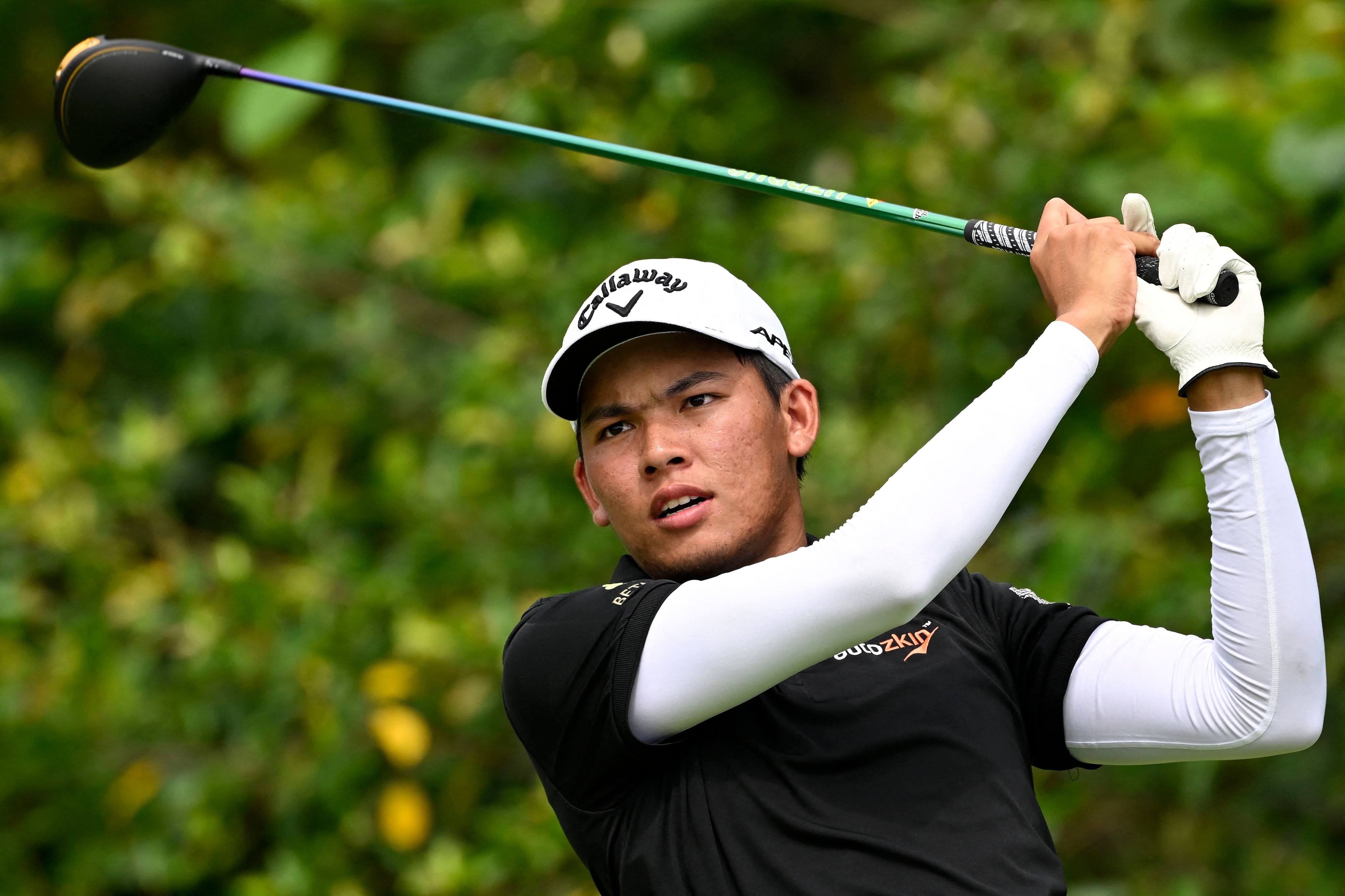 Phachara Khongwatmai of Thailand plays a shot during his surge into the joint lead in the third round of the International Series Singapore. Photo: AFP / Asian Tour