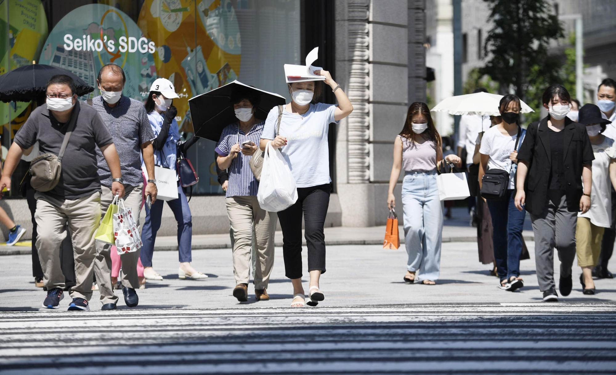 People in Japan are still wearing face masks and observing social-distancing rules, according to Waseda University professor Toshimitsu Shigemura. Photo: Kyodo