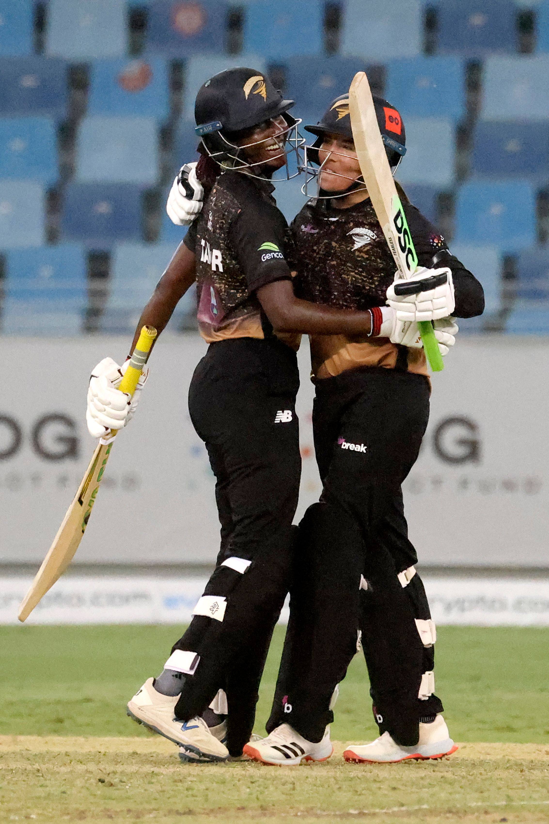 Tornadoes’ captain Stafanie Taylor (left) celebrates with teammate Sune Luus after their win in the FairBreak Invitational 2022 women’s final at the Dubai International Cricket Stadium on May 15, 2022. Photo: AFP