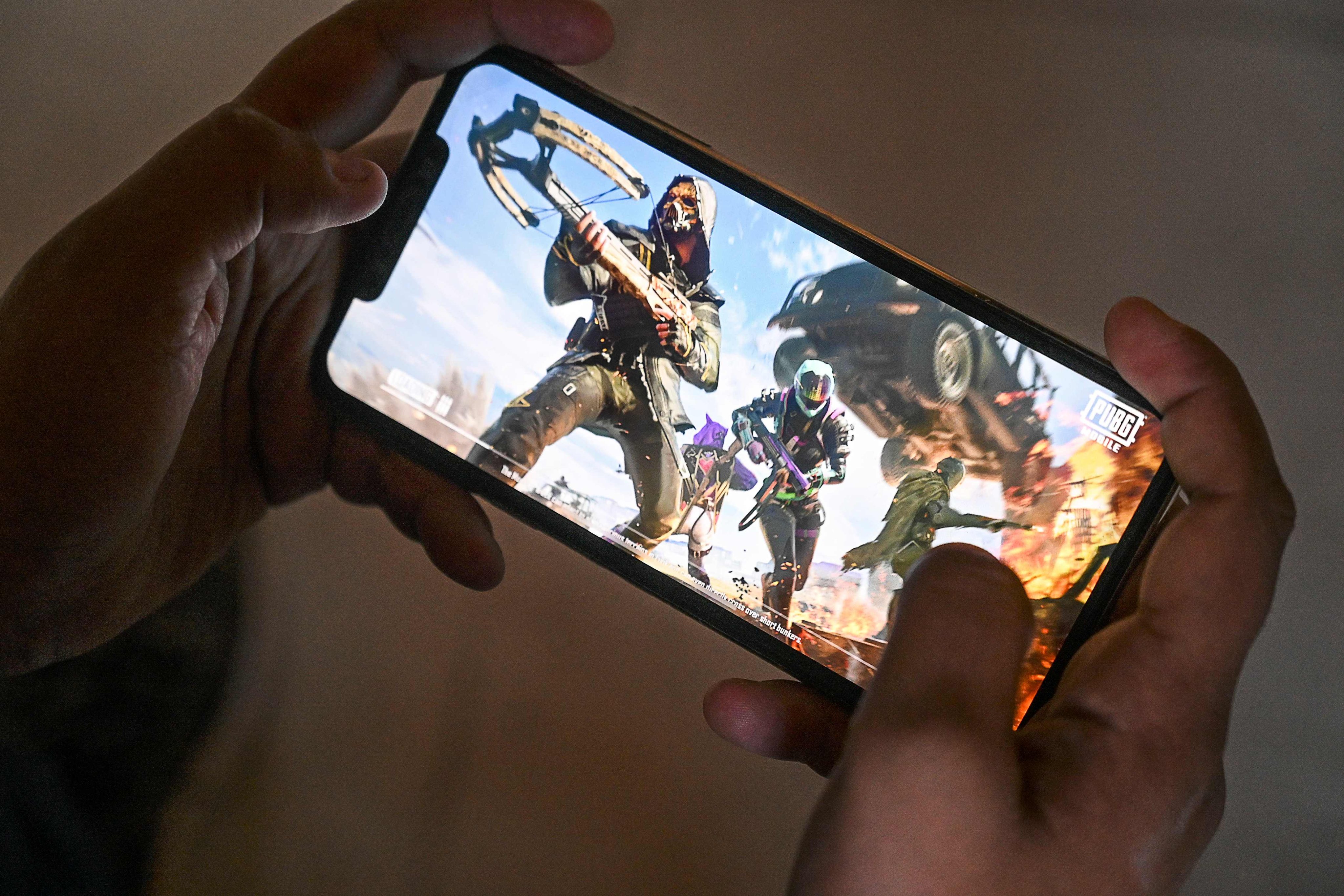 A gamer plays the PUBG Mobile game on a smartphone. Photo: AFP