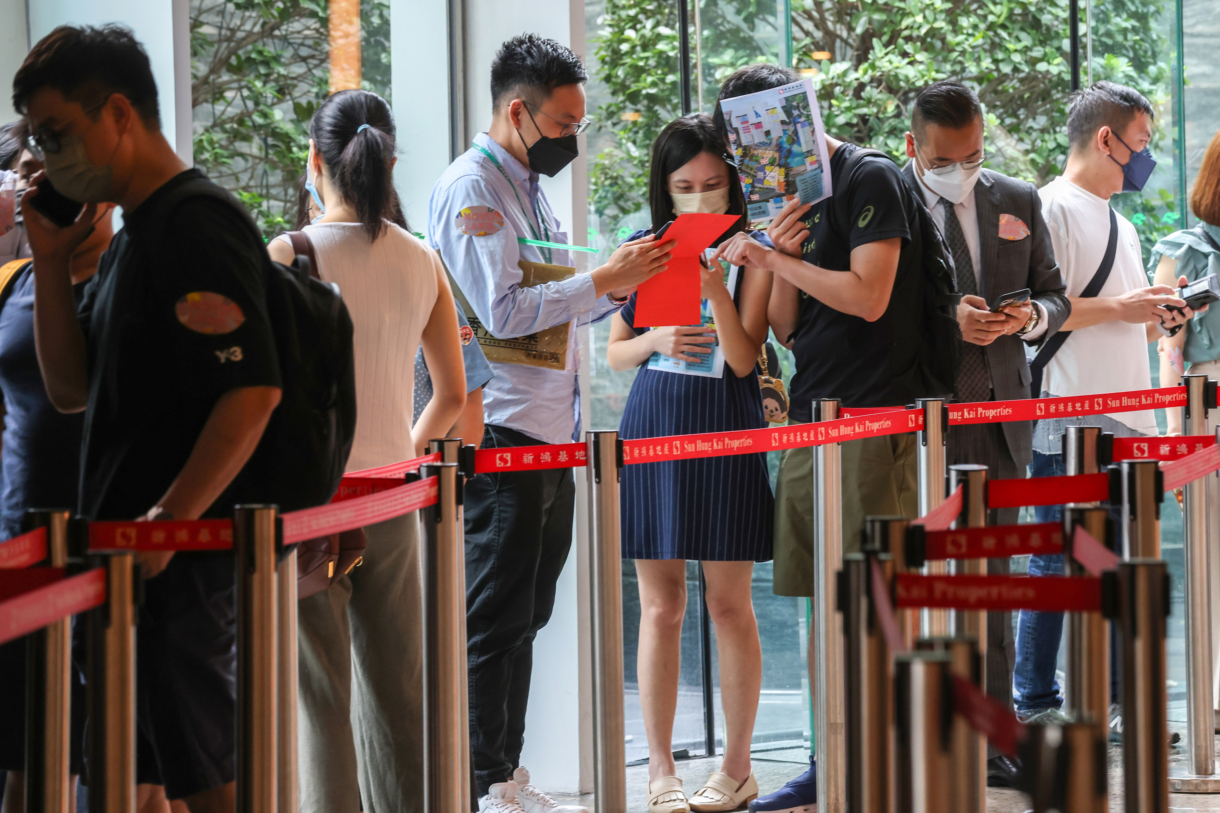 Buyers, many of them young, lining up at the sales office of Novo Land. Photo: Joanathan Wong