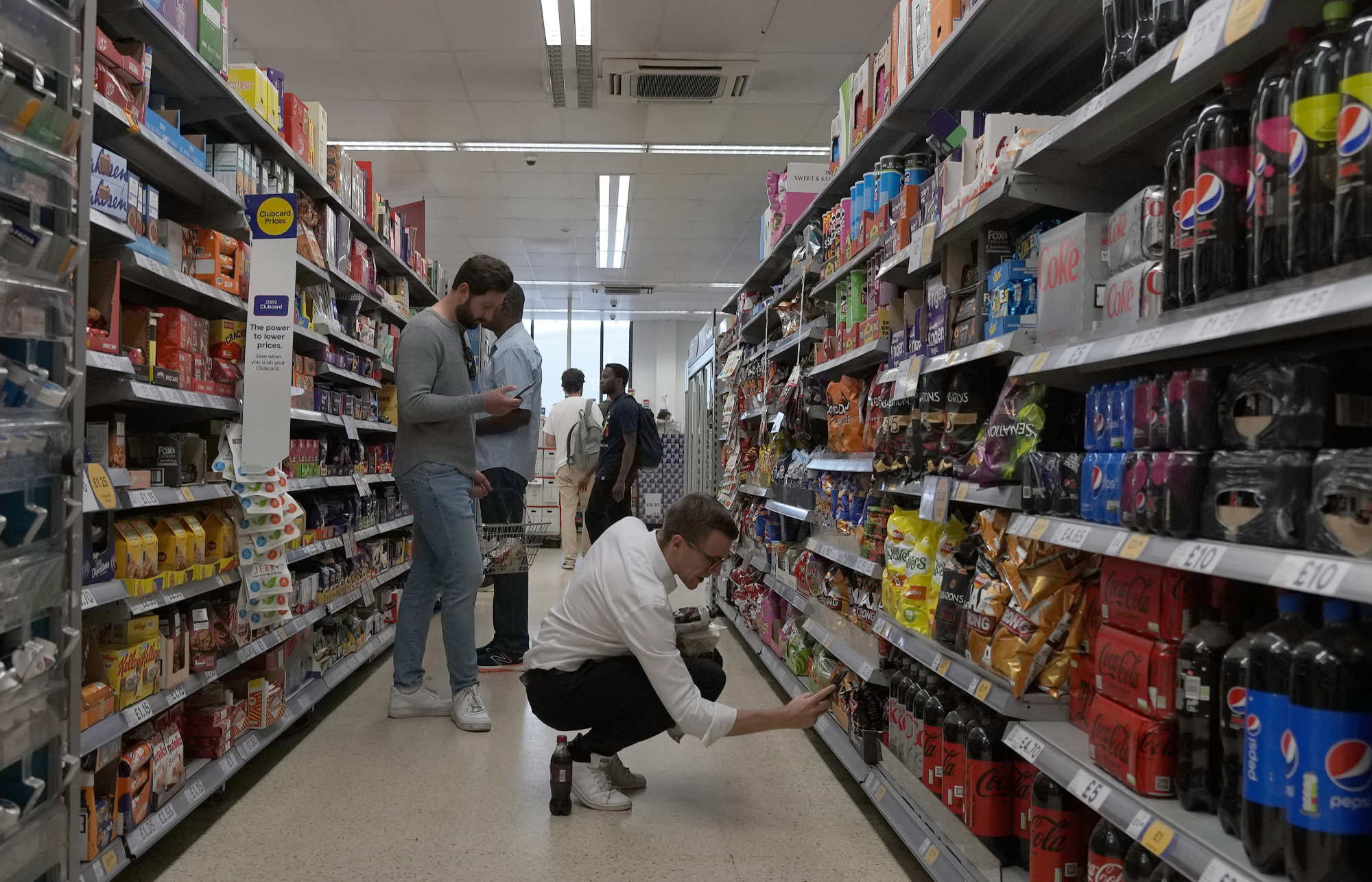 Shoppers buy snacks at a supermarket in London. The average UK diet is high in sugar. Photo: AP
