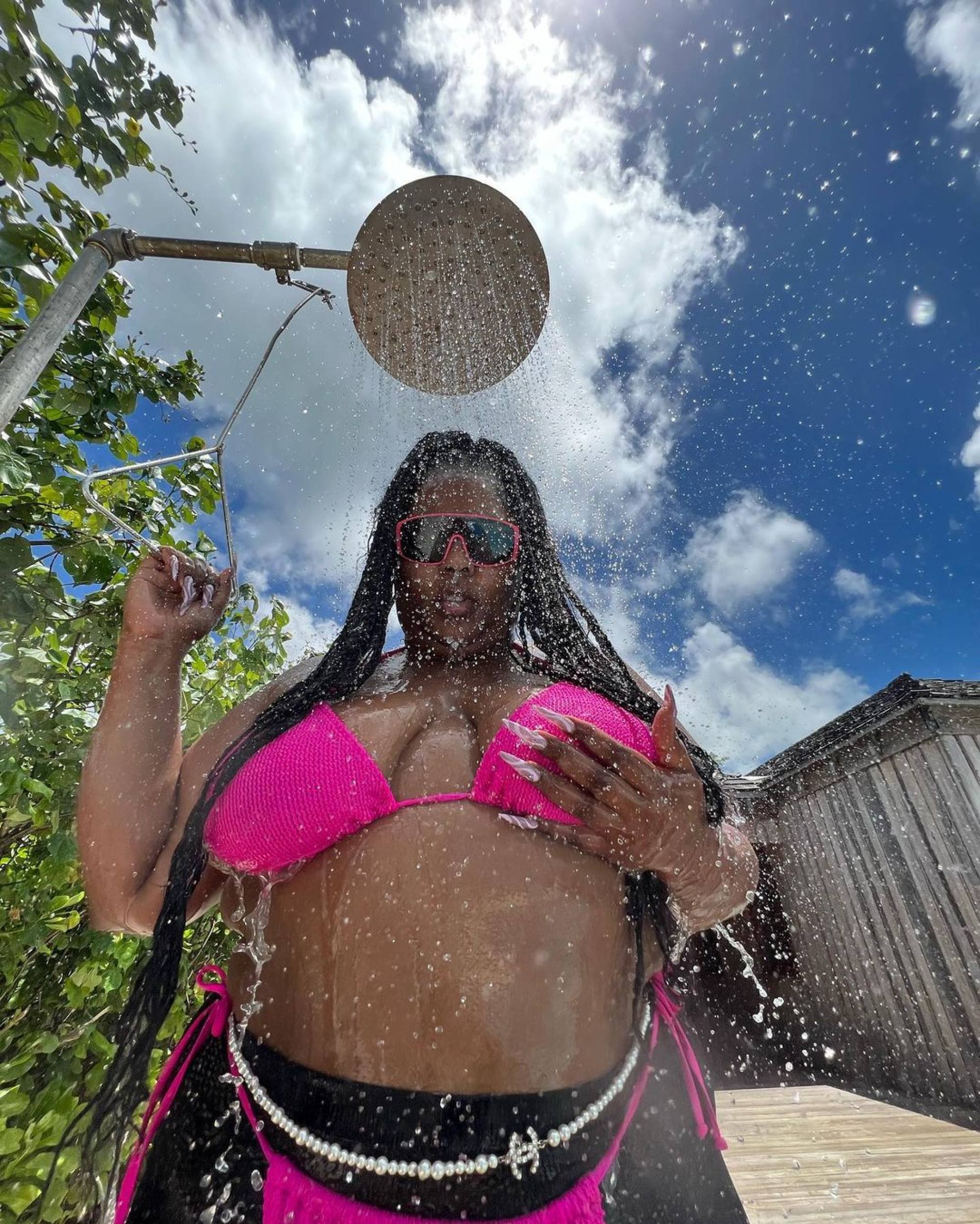 Lizzo shows off her famous curves in skimpy sports bra and