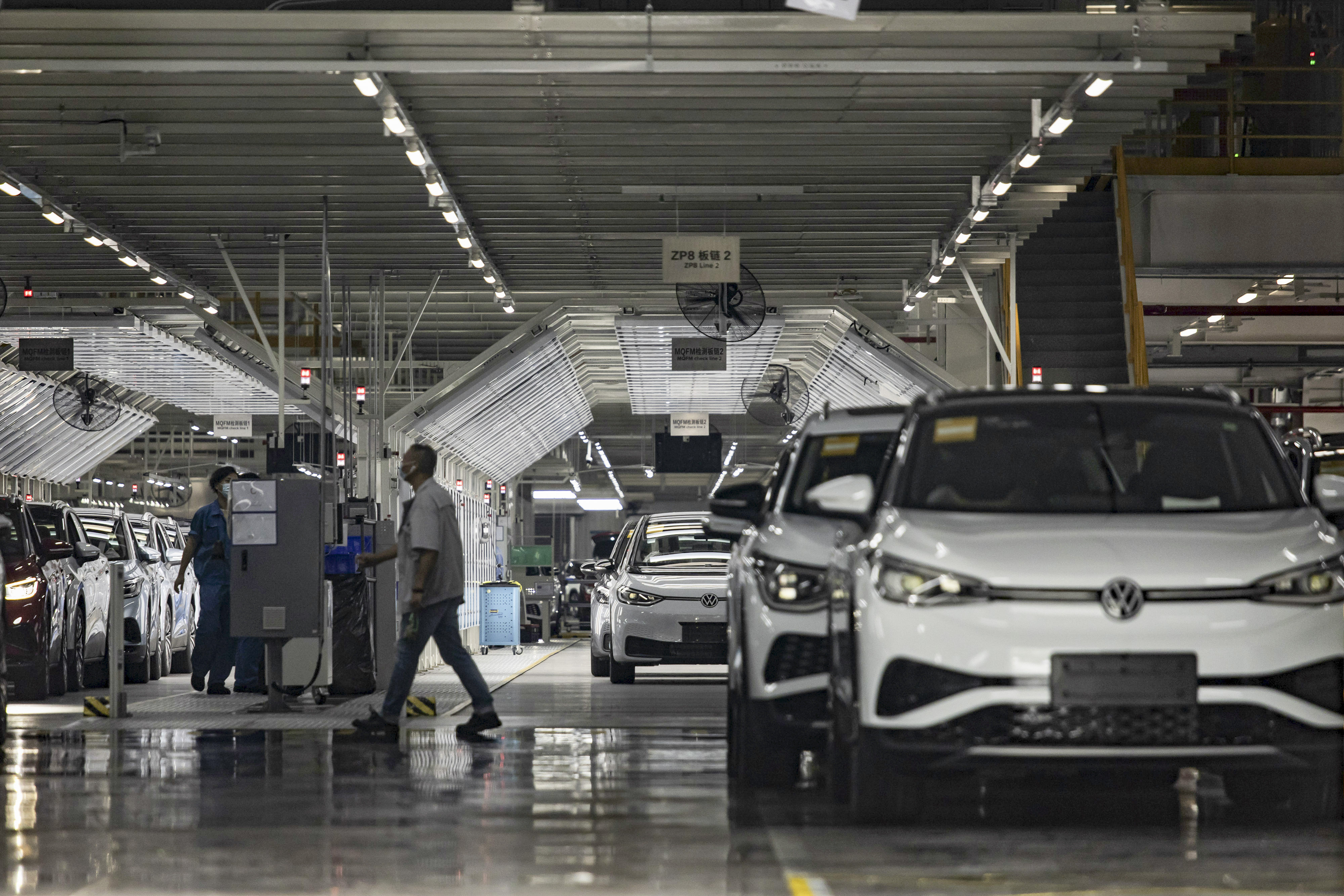 Volkswagen electric vehicles are assembled at the carmaker’s factory, operated with local partner SAIC Motor, in Shanghai. Photo: Bloomberg