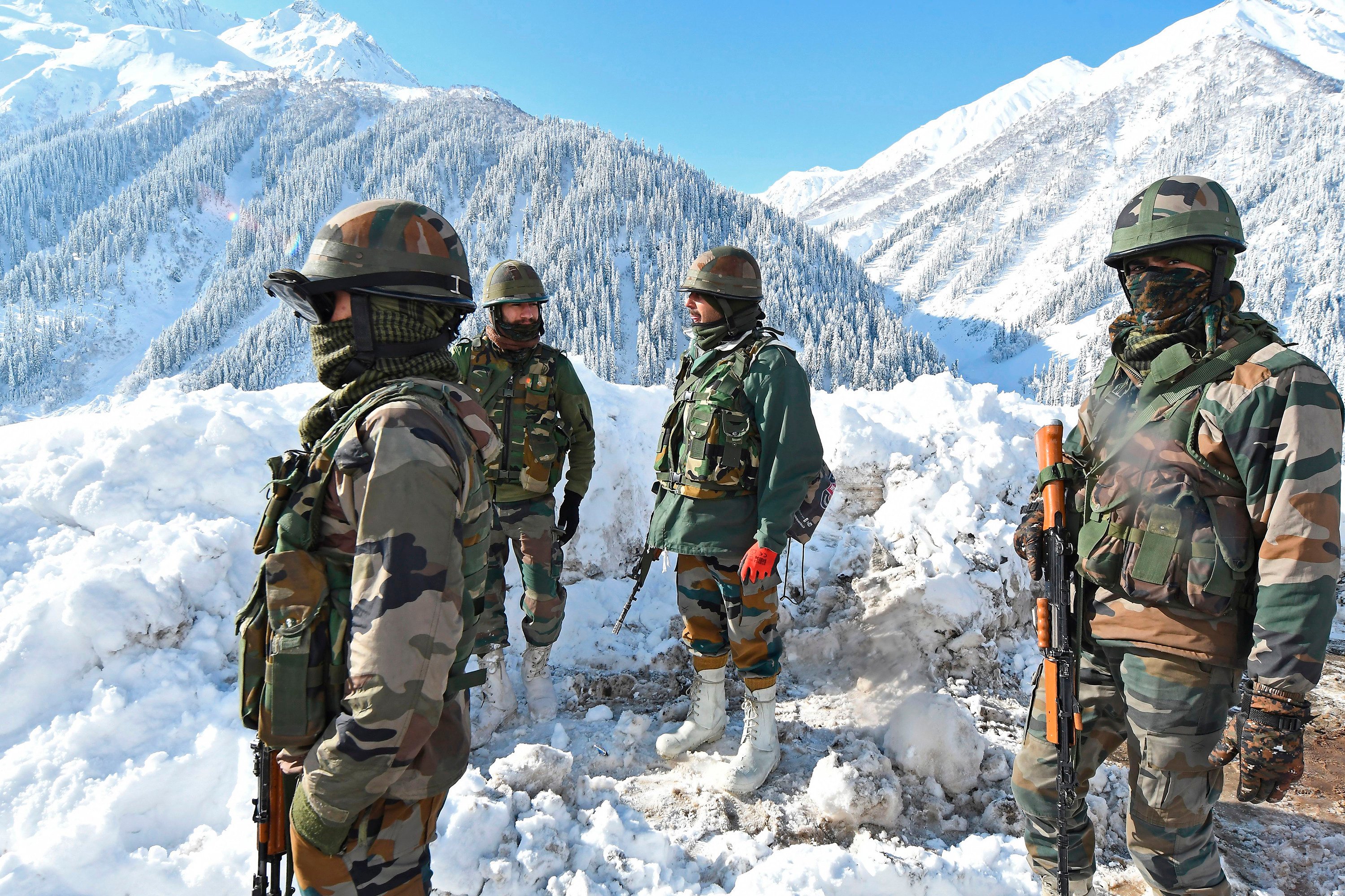 Indian army soldiers stand on a snow-covered road near the border with China. File photo: AFP via Getty Images/TNS