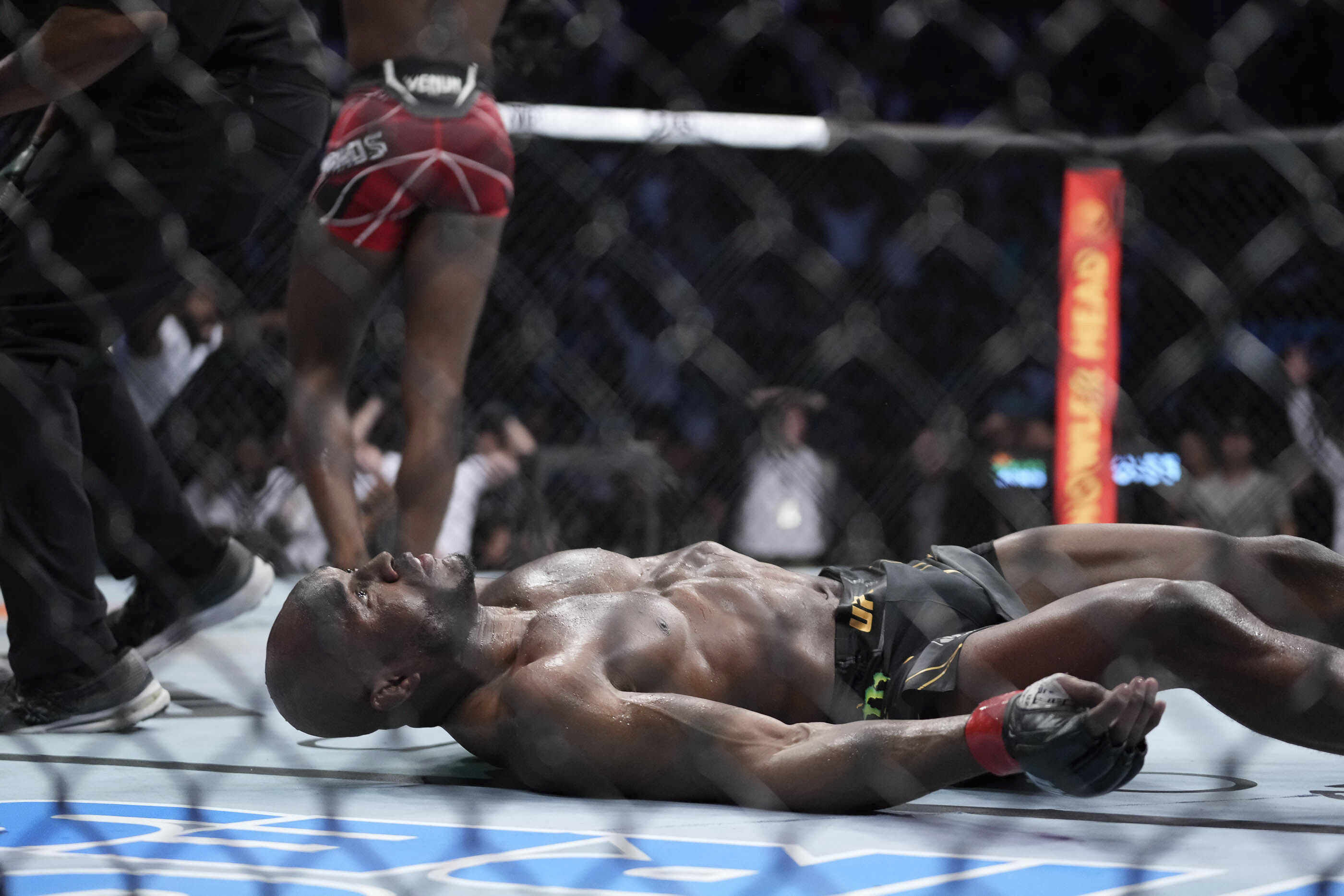 Kamaru Usman lays on the canvas after getting knocked out by Leon Edwards at UFC 278. Photo: AP