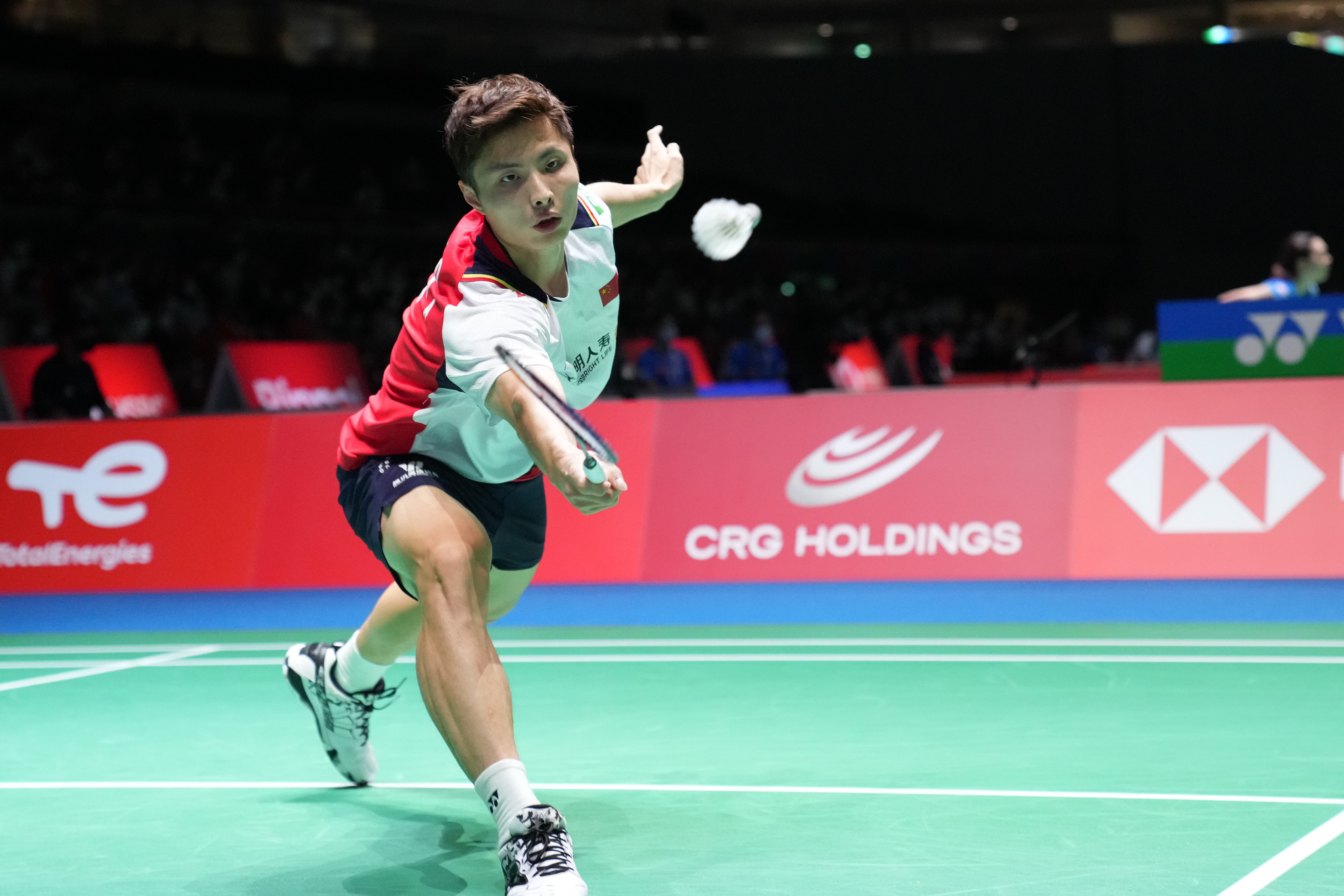 Shi Yuqi of China hits a return during the men’s singles first round match against Ade Resky Dwicahyo. Photo: Xinhua