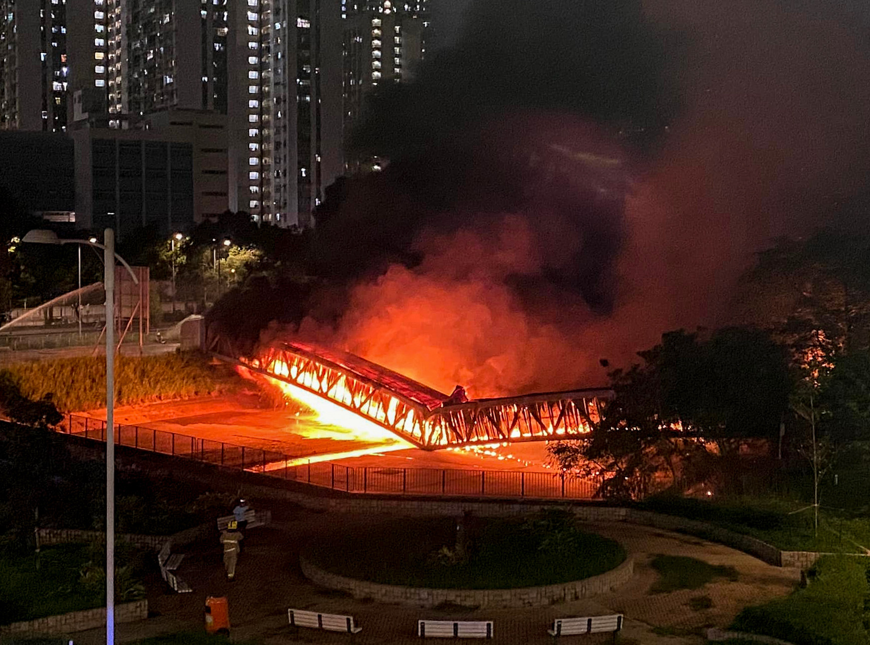 A cable bridge fire that cut off power to about 140,000 homes and disrupted rail services in June. Photo: Facebook..