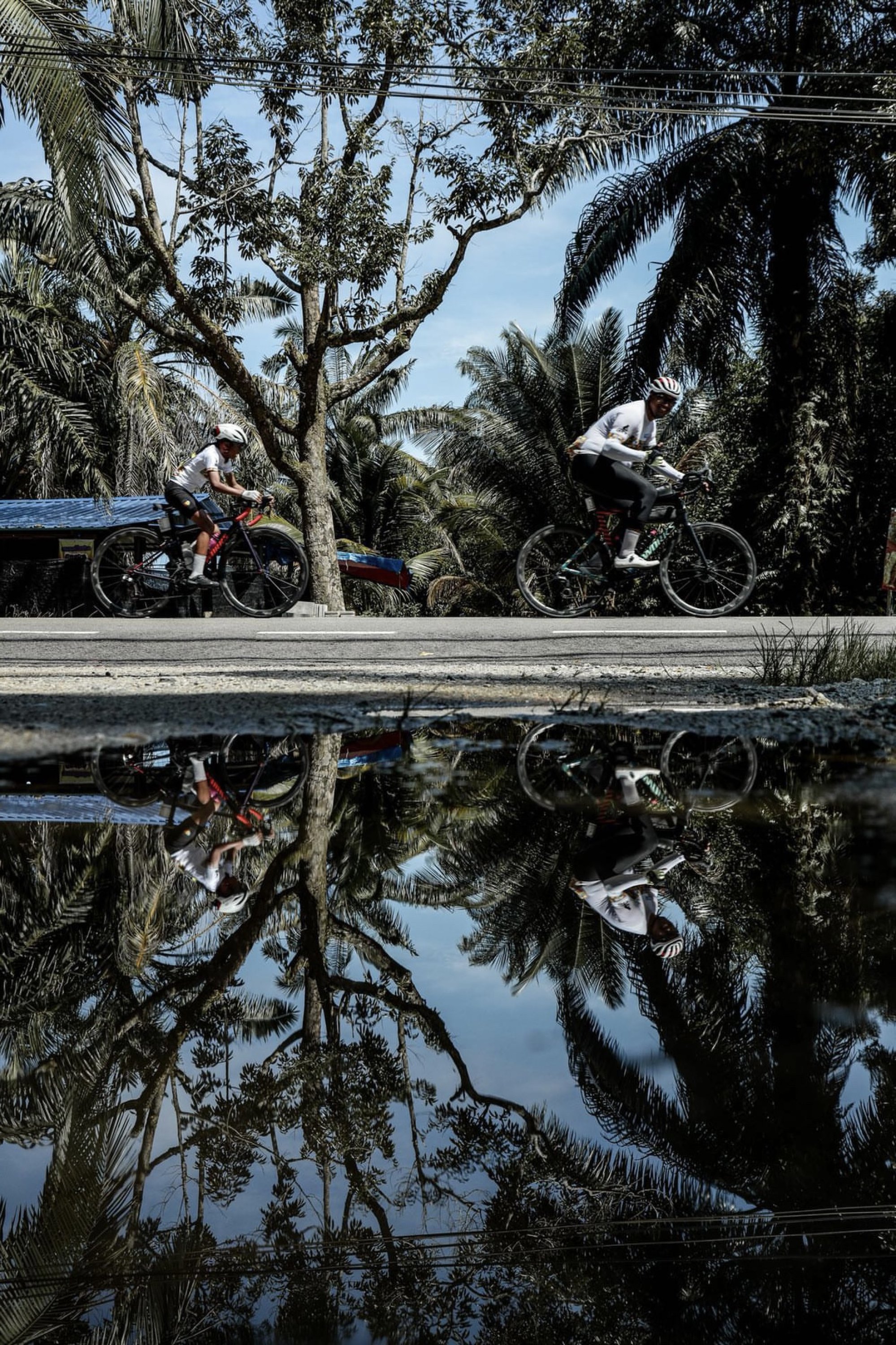 Uzair and his father on one of their bike trips. Photo: Taufiq Nadzri.
