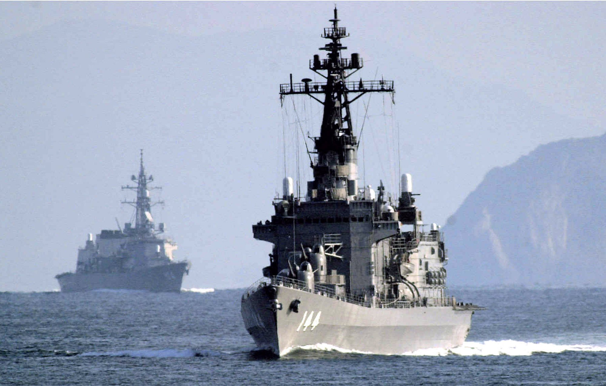 Japan’s destroyers, the 5,200-ton Kurama, front, and the 4,550-ton Kirisame – the latter participated in a joint naval exercise with Tonga this week. Photo: AP