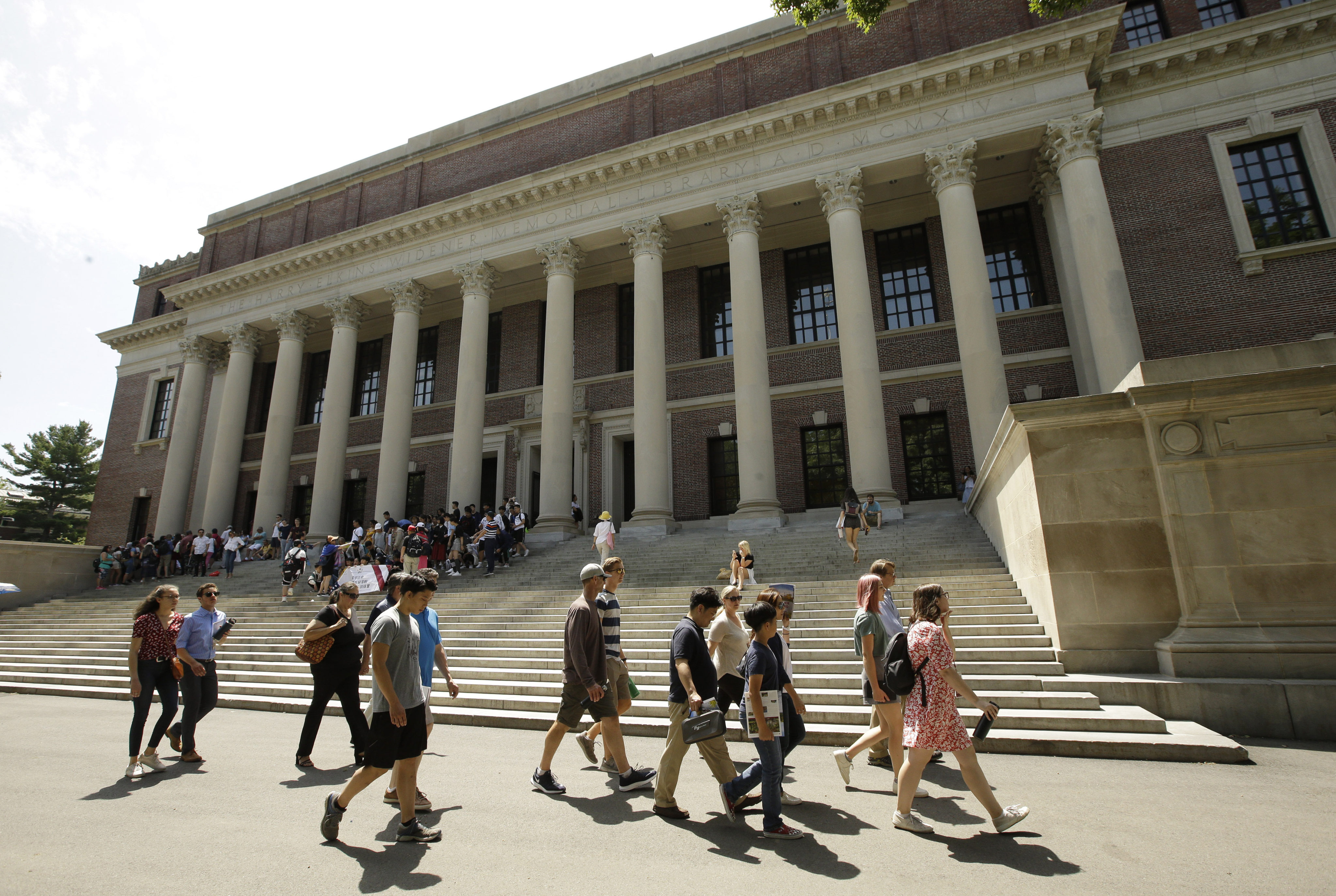 People pass the Widener Library at Harvard University in Massachusetts, US. Photo: AP