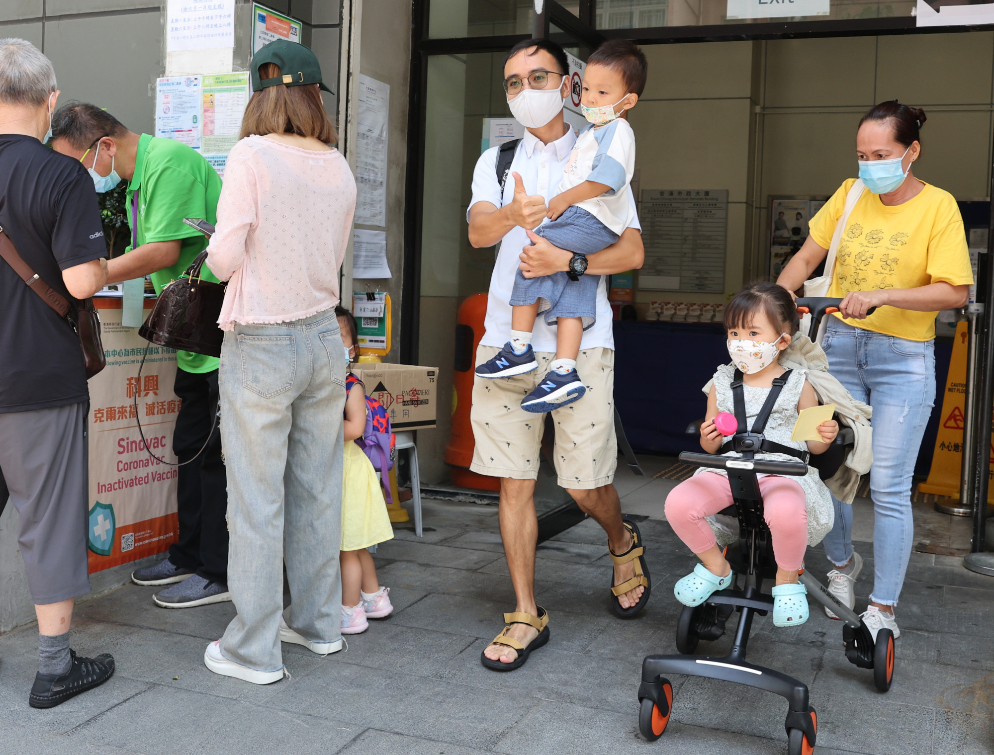 Young people receive the Sinovac Covid-19 vaccine at the Community Vaccination Centre in the Kwun Chung Municipal Services Building. As Hong Kong vies with other governments for vaccines, it will take months for vaccine production to be ramped up and supplies delivered. Photo: Edmond So