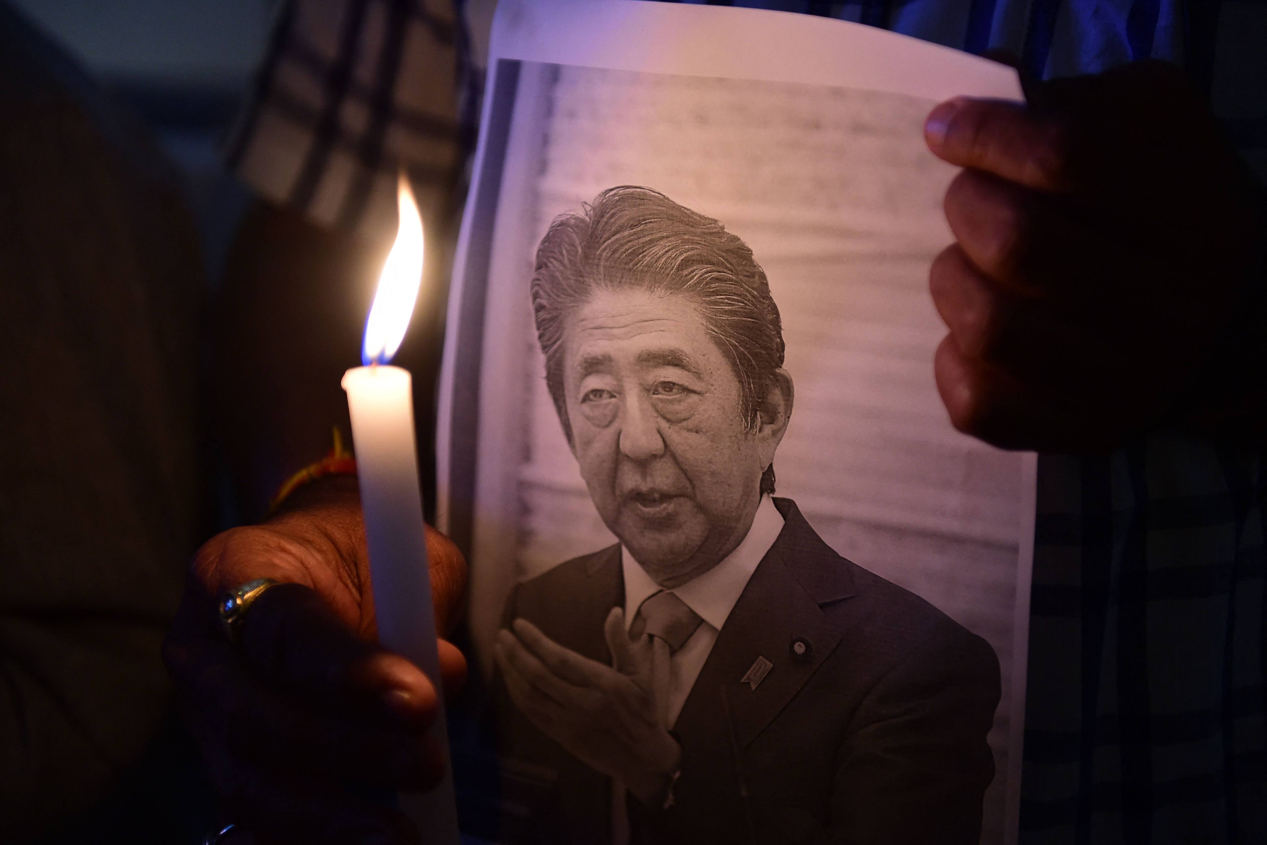 People pay tribute to former Japanese prime minister Shinzo Abe in Ahmedabad, India. File photo: AFP