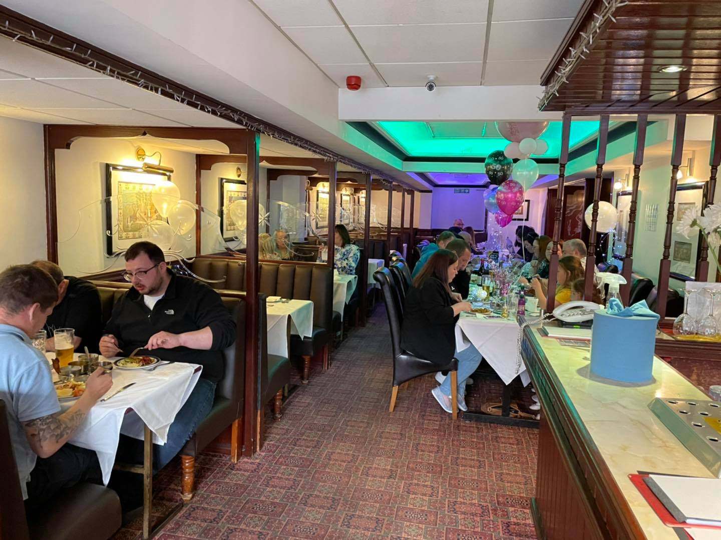 Customers dine at the Light of India restaurant in Britain. Photo: Facebook