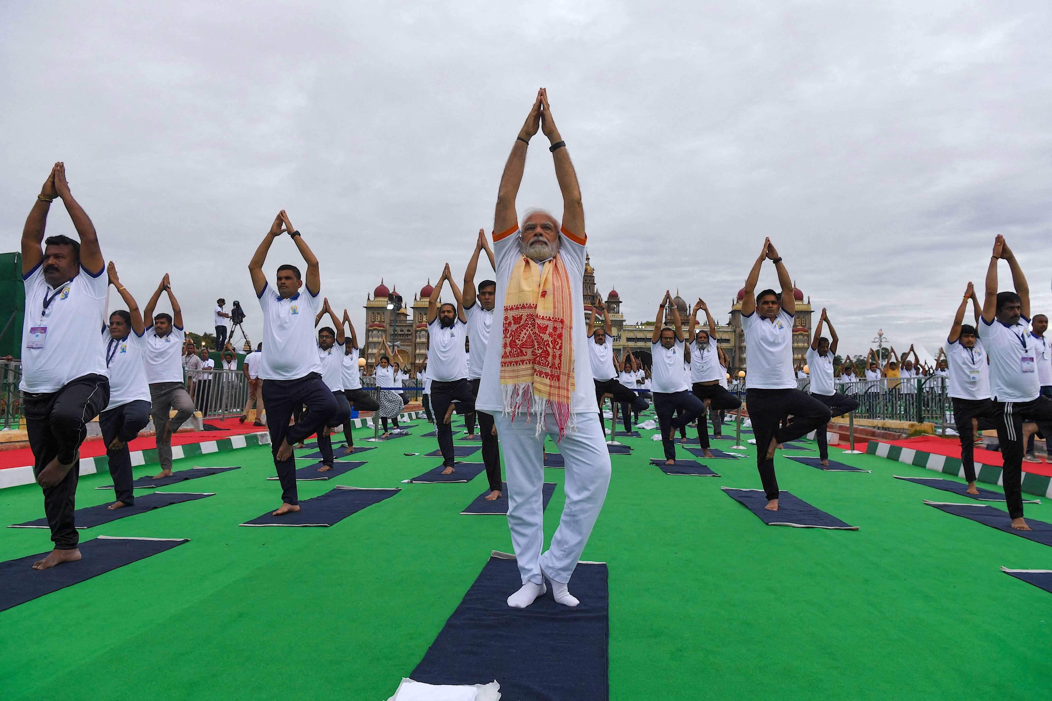 India’s Prime Minister Narendra Modi at the International Day of Yoga in front of Mysore Palace on June 21. Observers are questioning his balancing act. Photo: AFP