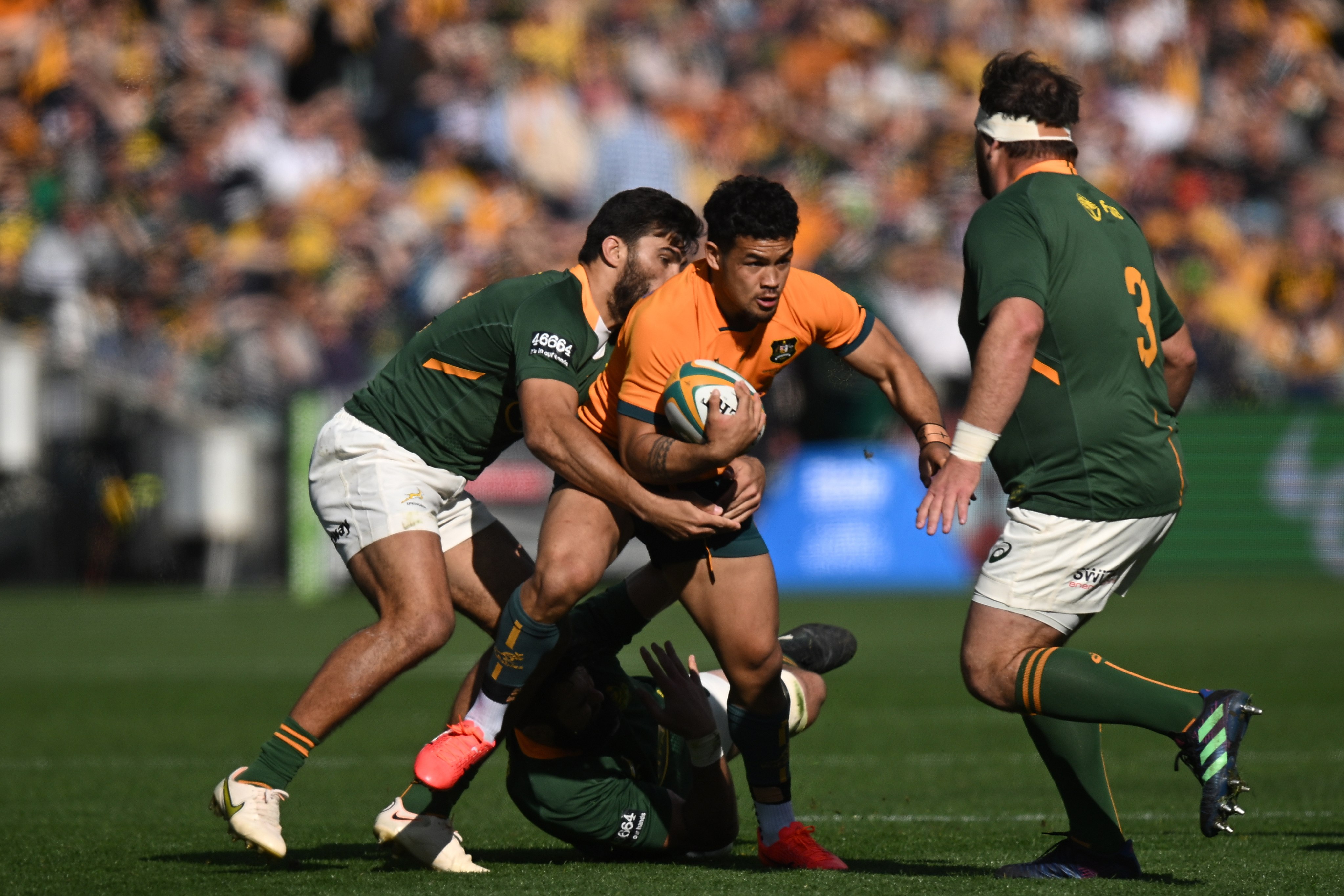 Hunter Paisam of Australia (centre) in action during the Rugby Championship Test match between the Wallabies and Springboks. Photo: EPA-EFE