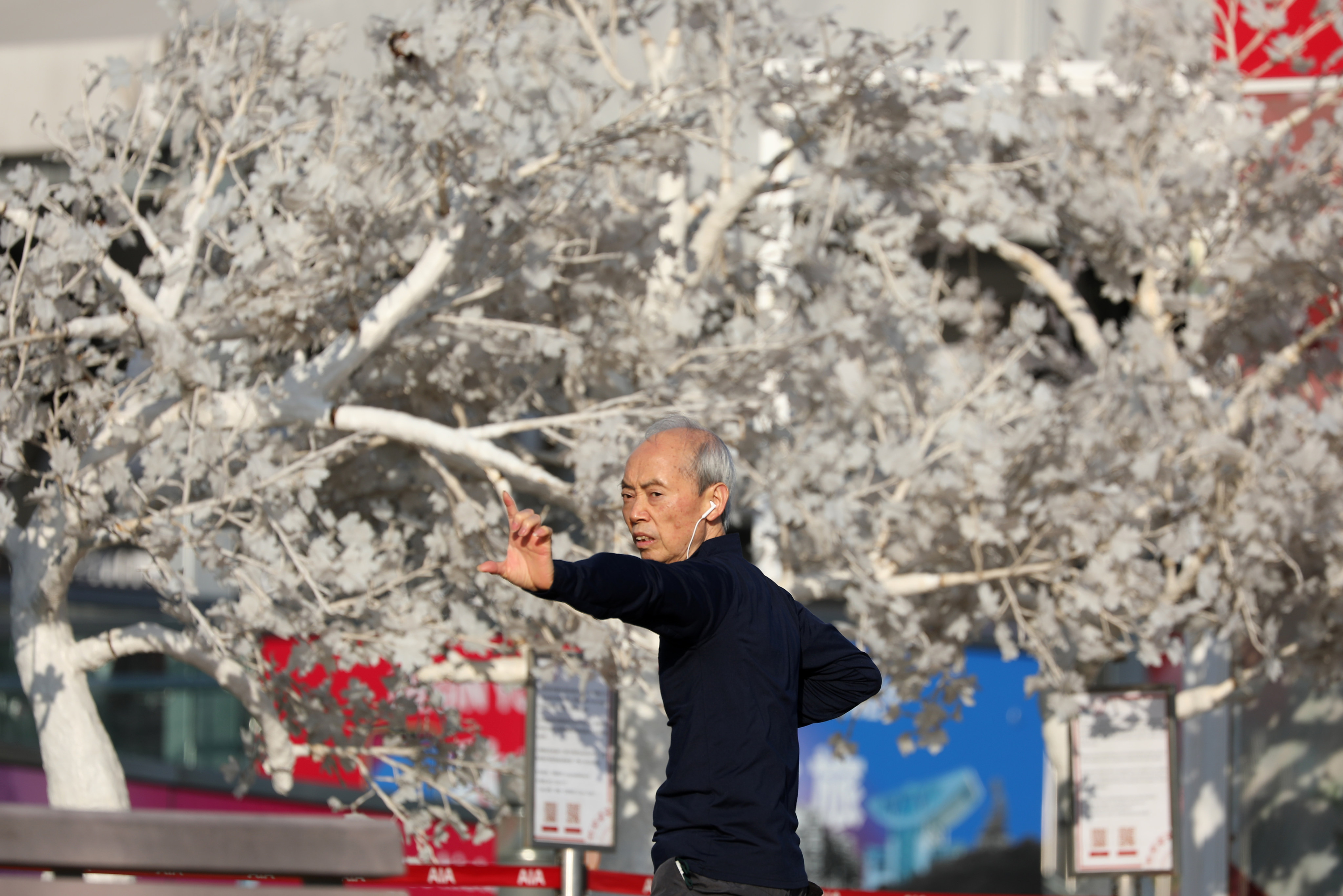 An elderly man exercises in Hong Kong’s Central district on December 30, 2020. Photo: Nora Tam