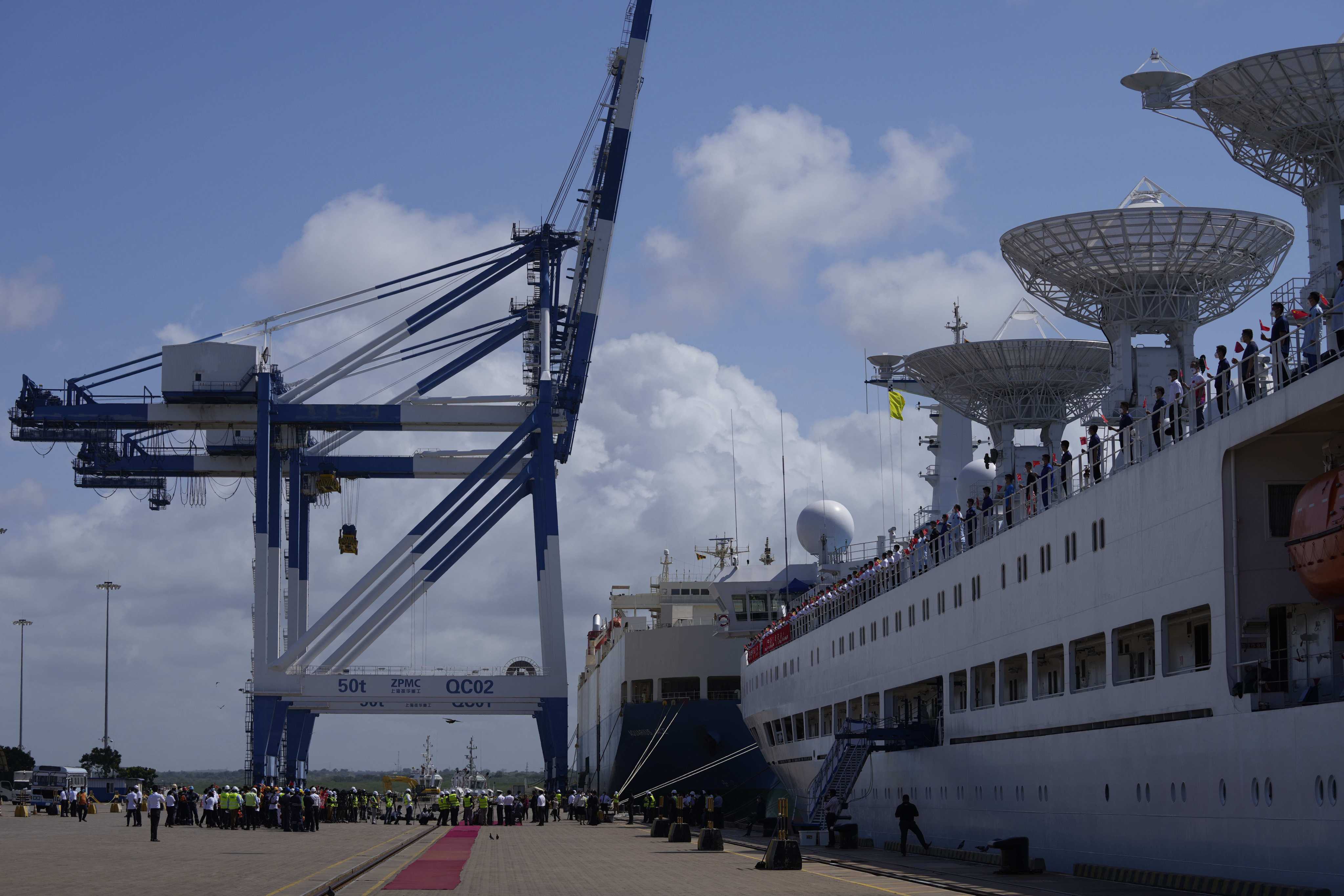Chinese research ship Yuan Wang 5, right, is seen berthed at the Hambantota International Port in Hambantota, Sri Lanka on Tuesday. The ship was originally set to arrive Aug. 11 but the port call was deferred due to apparent security concerns raised by India. Photo: AP/File