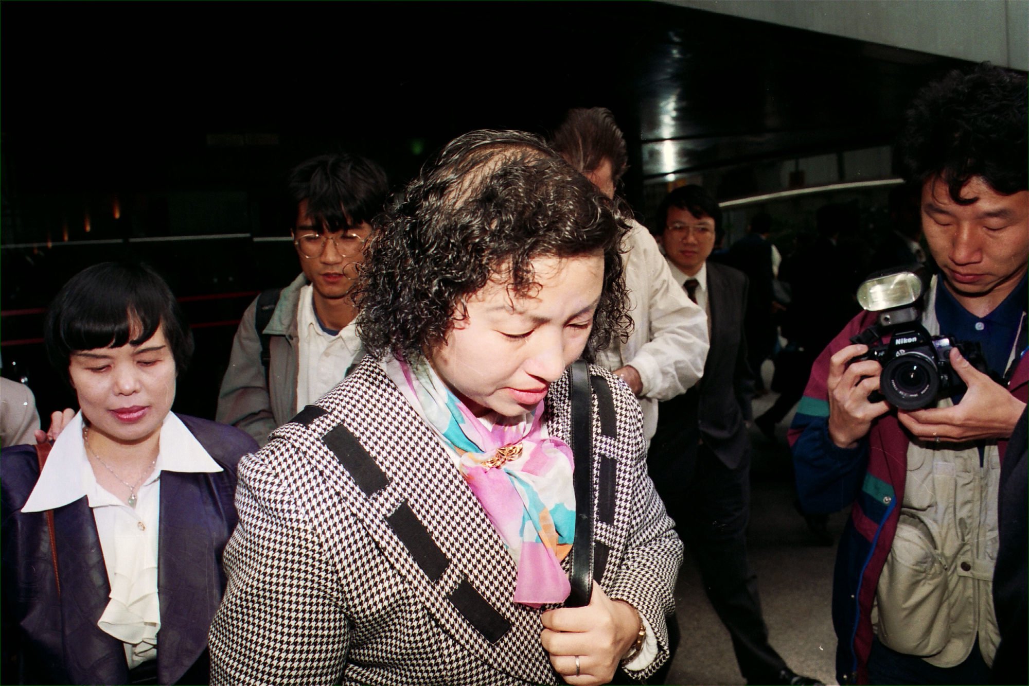 The engineers’ widows, Wong To Sau-heung (front) and Yip Au Lai-chun, leave the Coroner’s Court after the inquest. The case returned a verdict of death caused by lack of care. Photo: SCMP