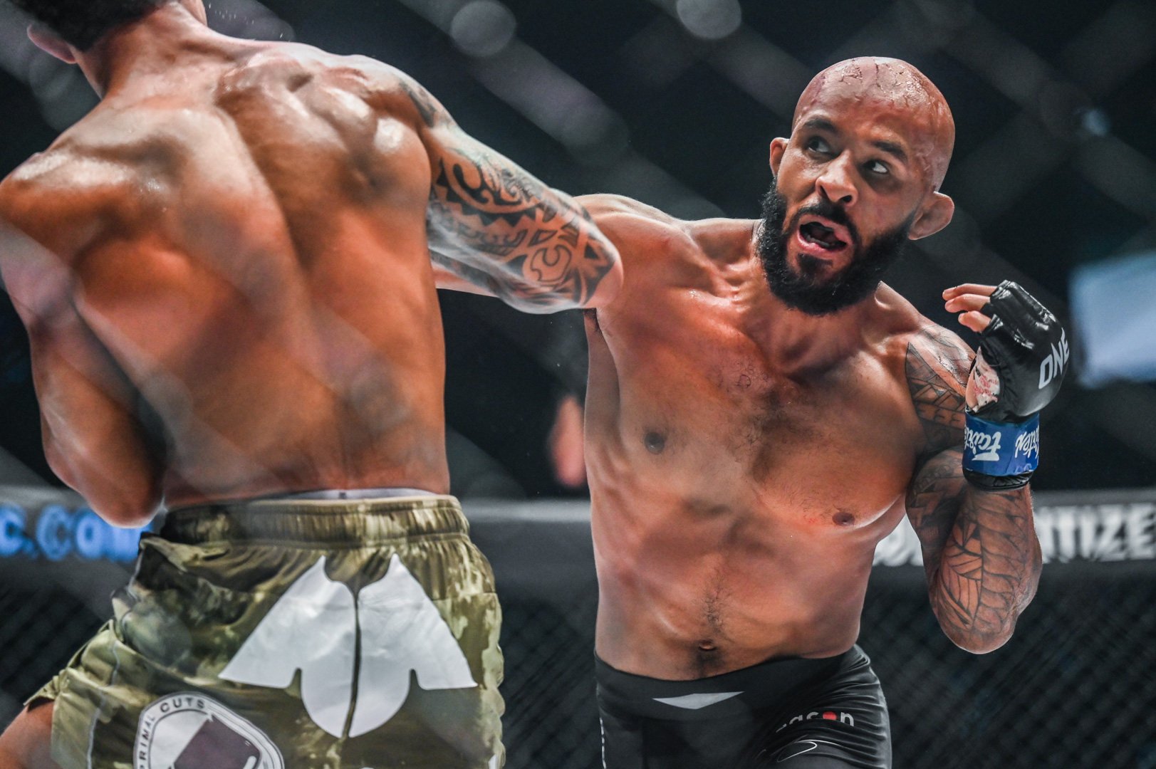 Demetrious Johnson throws a punch at Adriano Moraes at ONE on Prime Video 1. Photo: ONE Championship.