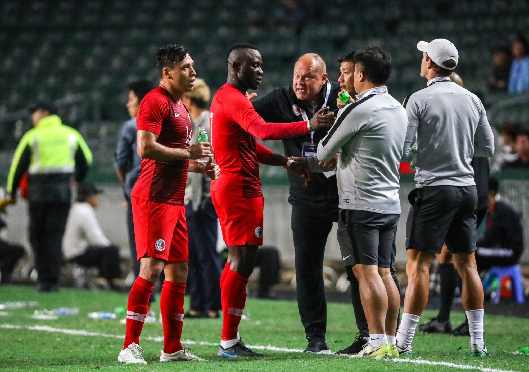 Former Hong Kong coach Mixu Paatelainen (centre, black shirt) and his players in 2019, when they last played at home. Photo: May Tse