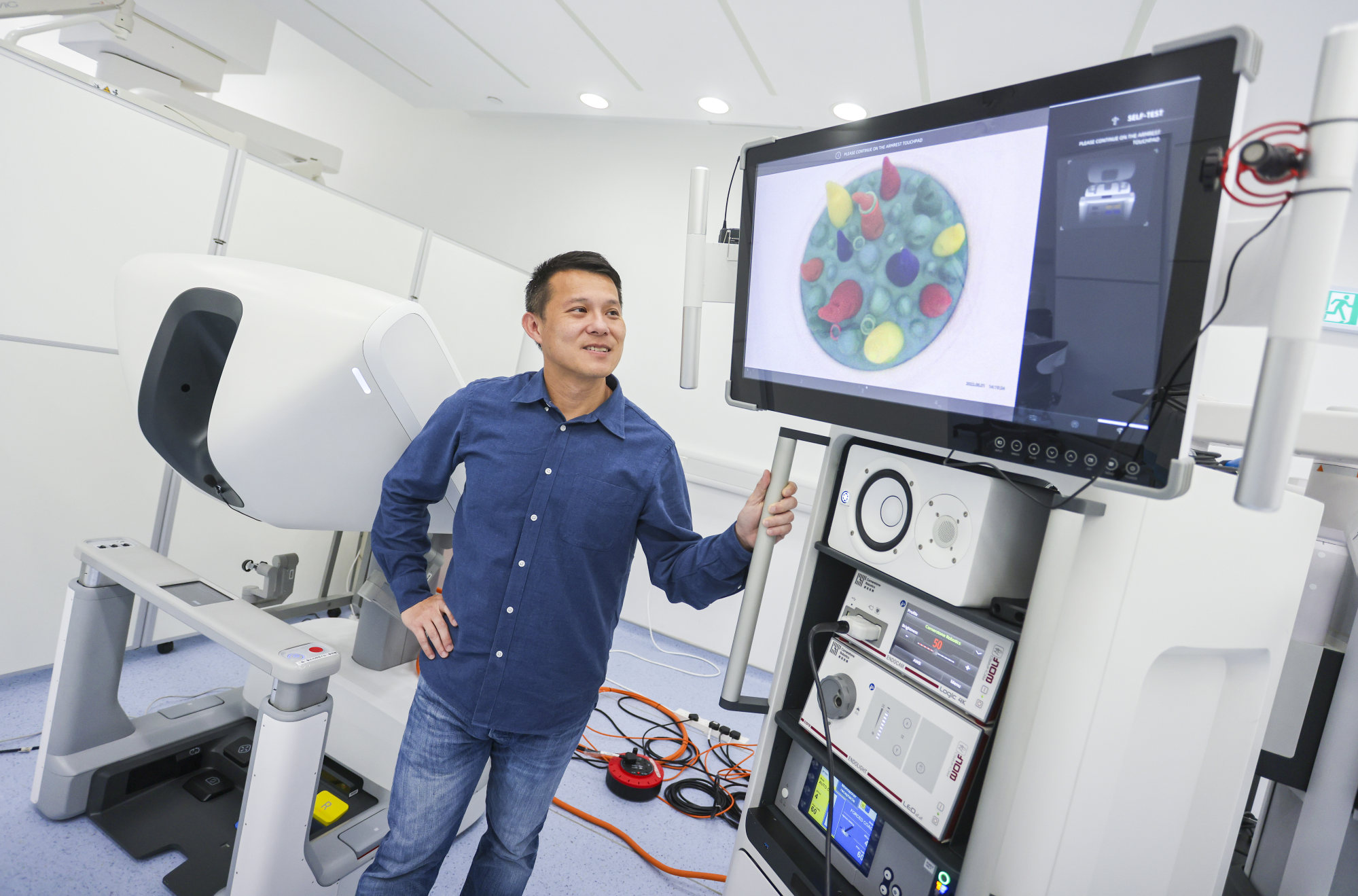 Founder of Cornerstone Robotics and Spirit of Hong Kong Awards 2022 nominee Samuel Au, with a CSR Robot, at his centre at the Science Park in Sha Tin. Photo: Jonathan Wong