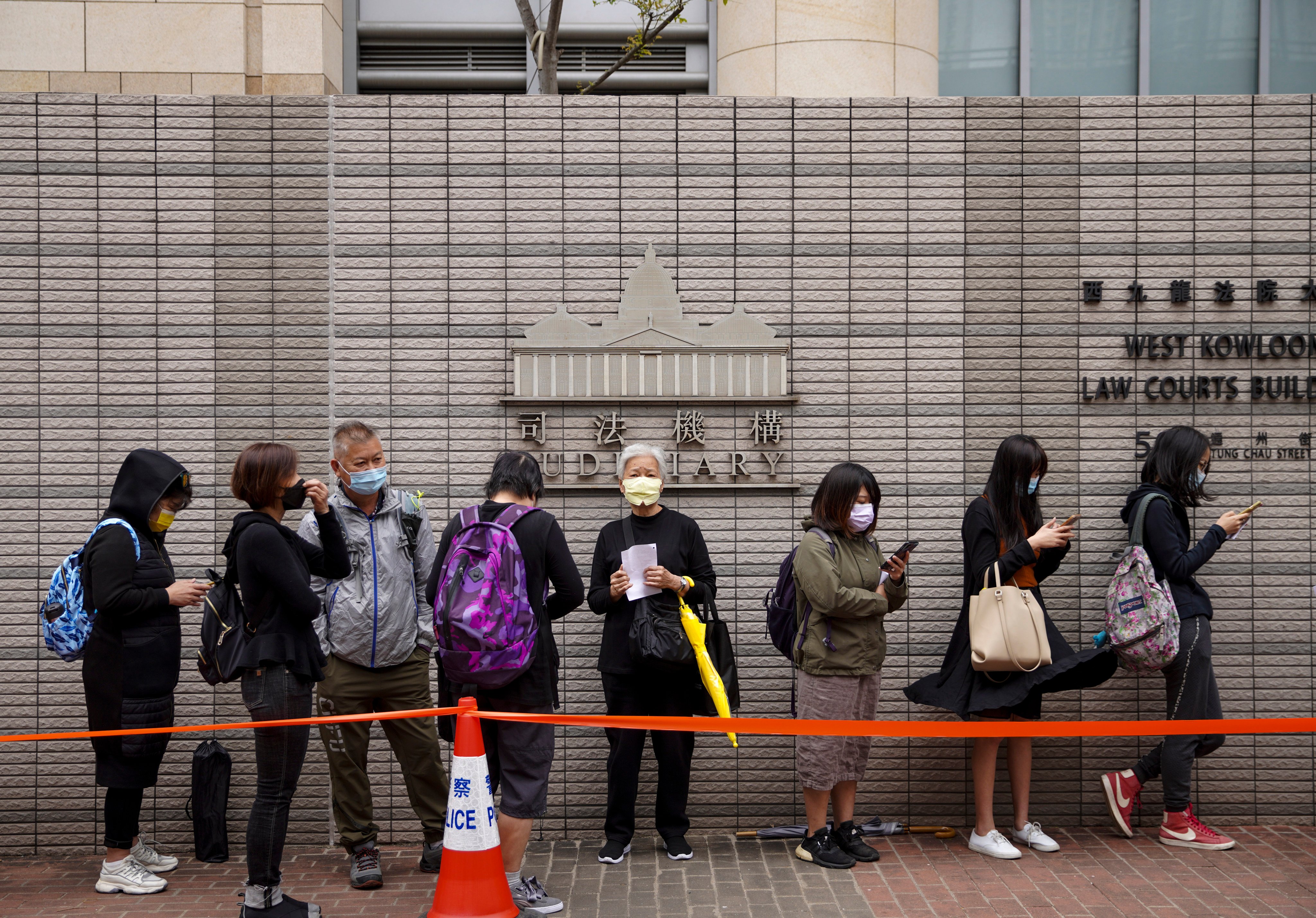 People queue to enter the West Kowloon Magistrates’ Courts on March 3, 2021, to attend a hearing for the 47 activists. The secretary for justice has since indicated that the case will be tried without a jury. Photo: Winson Wong 