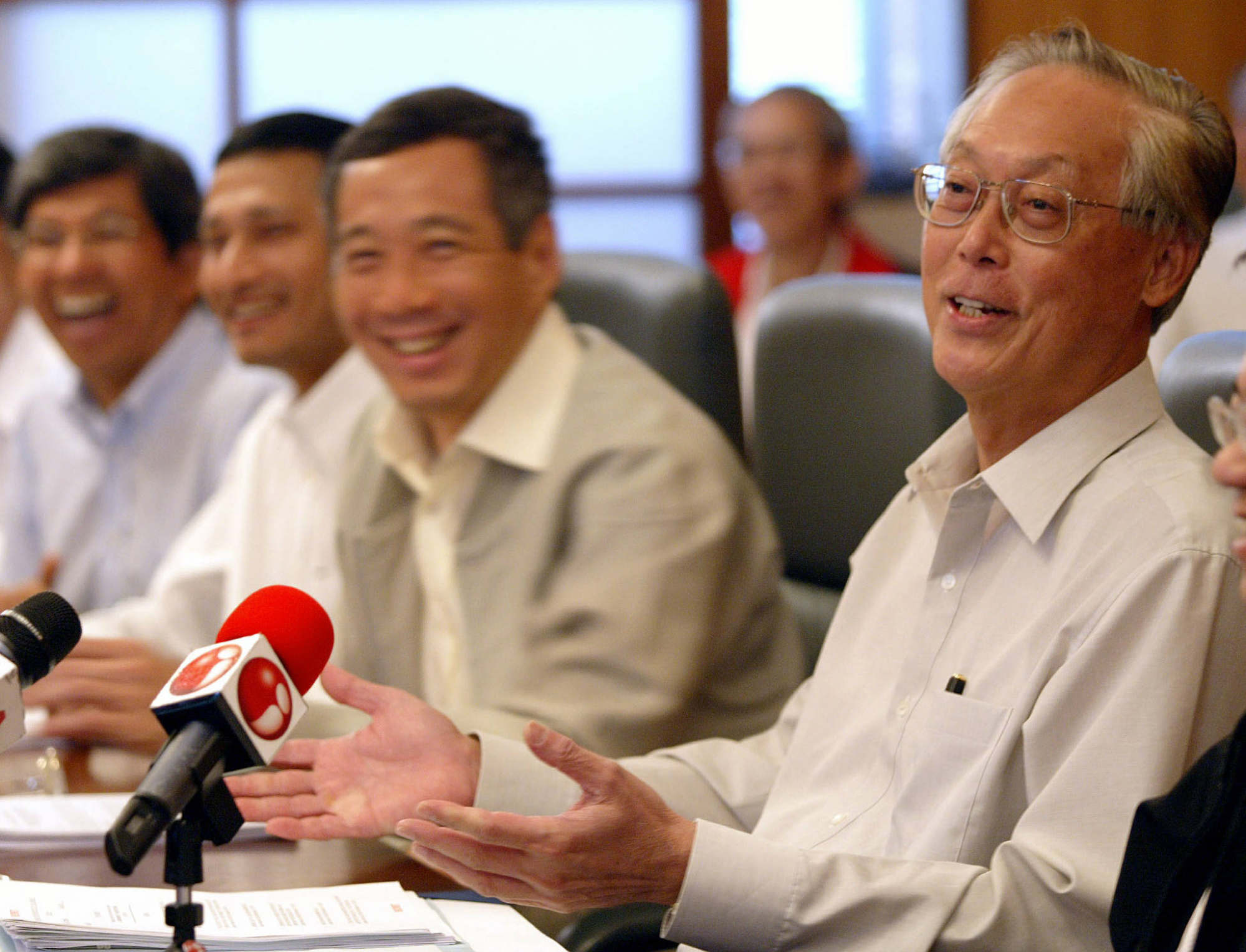 Prime Minister Goh Chok Tong (right) shares a joke during his last cabinet meeting at the Istana Presidential Palace along with incoming prime minister Lee Hsien Loong (second from right) in August 2004. Photo: Straits Times