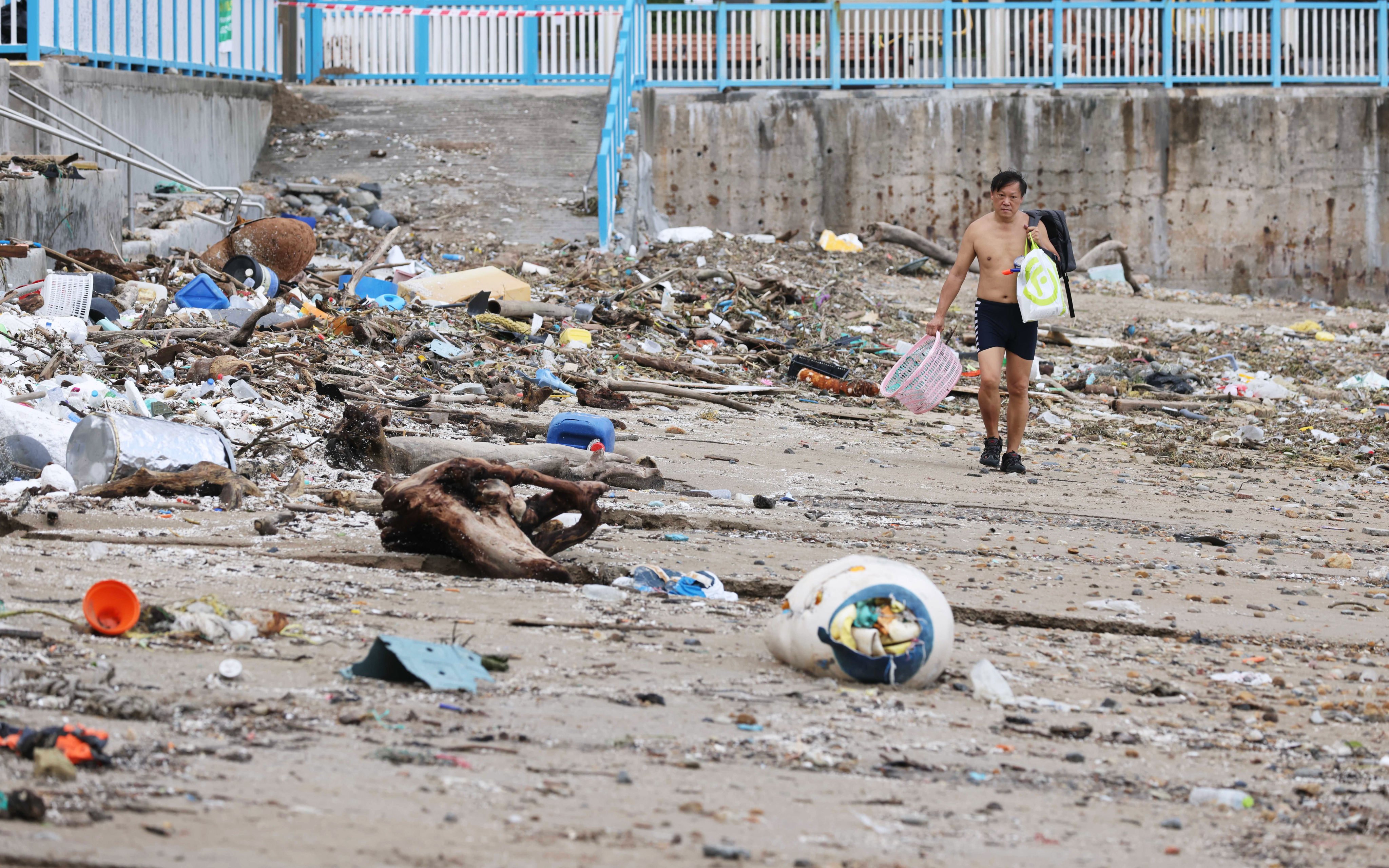 Plastic waste swept onto Hong Kong’s shorelines by Typhoon Kompasu lies strewn across Silverstrand Beach in Sai Kung, on October 14, 2021. Photo: May Tse
