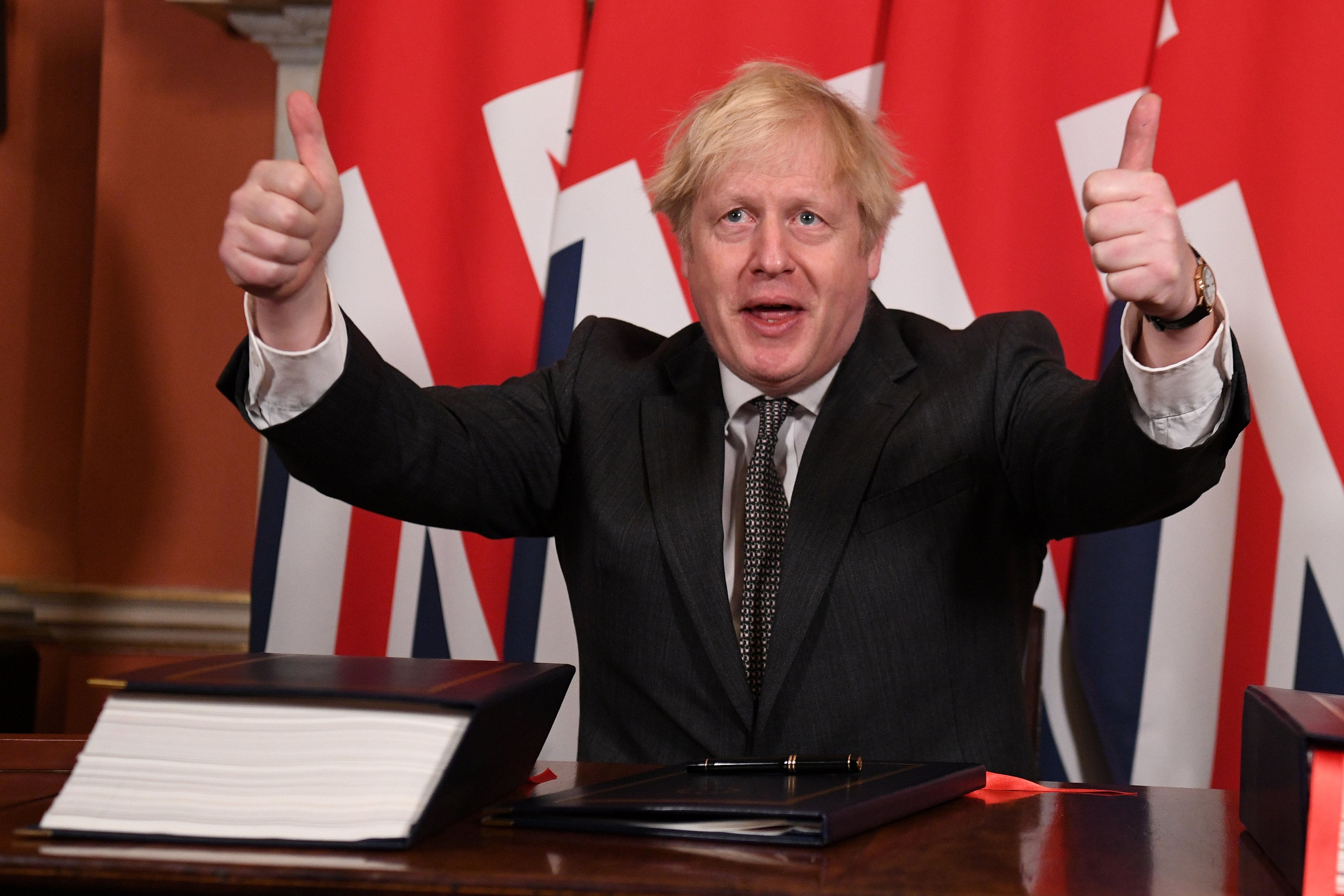 Britain’s Prime Minister Boris Johnson gives a thumbs up after signing the Brexit trade deal with the EU in London in December 2020. Photo: Reuters