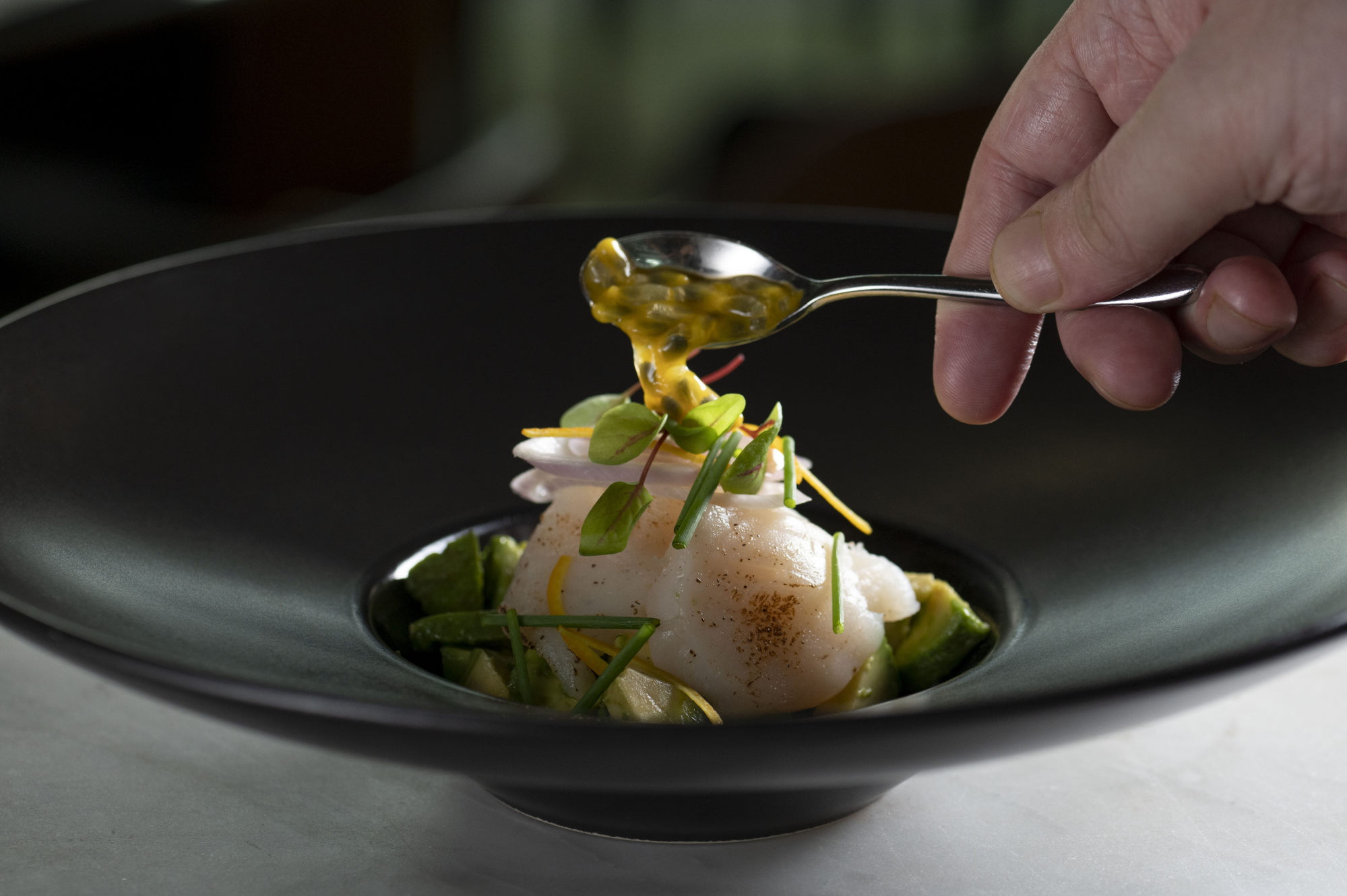 Porterhouse Seafood & Steak’s ceviche Hokkaido scallop is drizzled in squeezed yuzu, orange zest and passion fruit. Photo: Handout