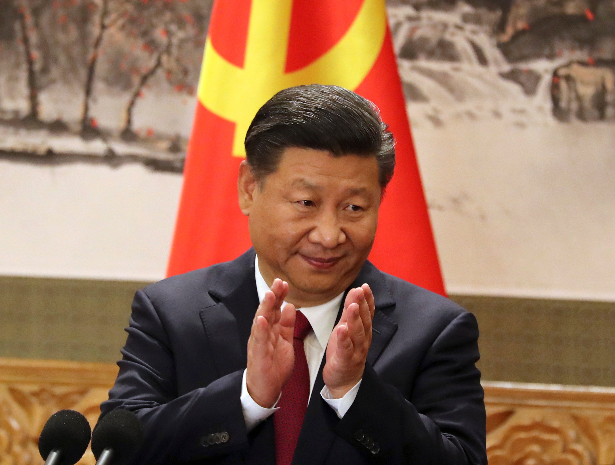 Chinese President Xi Jinping claps while addressing the media as he introduced new members of the Politburo Standing Committee on the final day of the 19th party congress at Beijing’s Great Hall of the People in 2017. Photo: AP