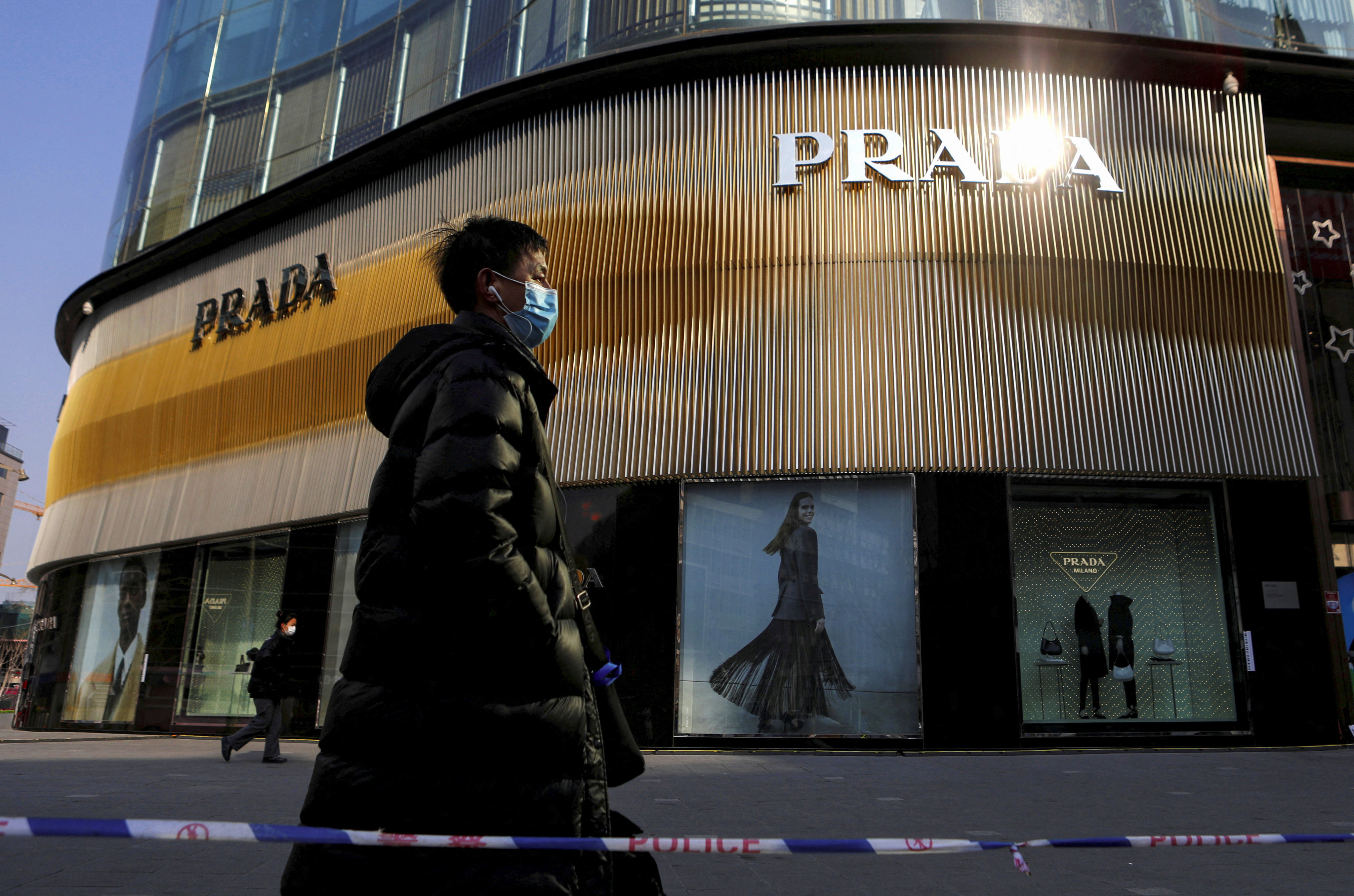 A Prada store in Beijing. Premium consumer and luxury goods brands have cut an 18 per cent year-on-year growth forecast on average for their mainland China businesses to 3 per cent, according to consultancy Oliver Wyman. Photo: Reuters