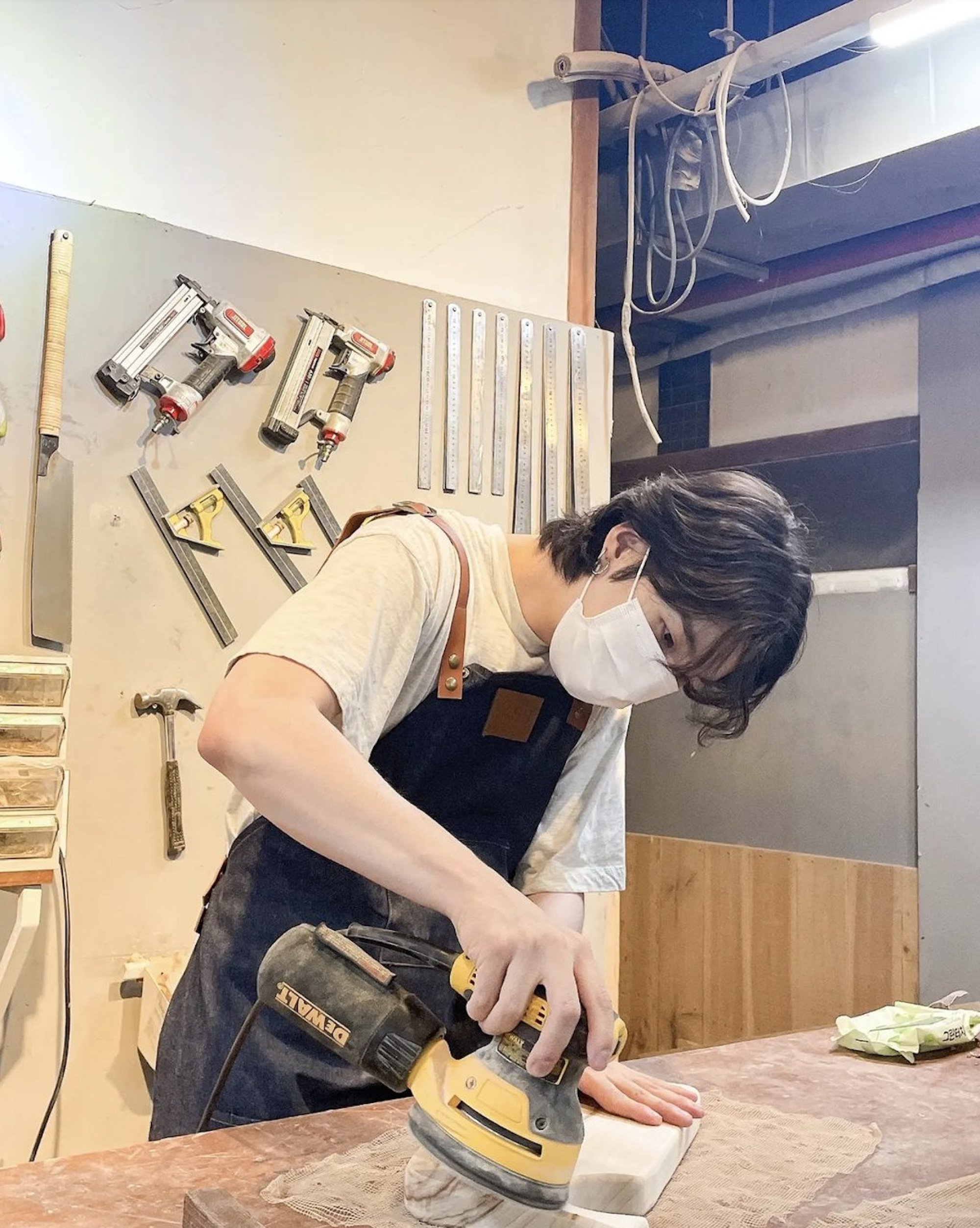 Suga recently posted a video of himself making whale-shaped chopping boards at a woodworking studio and seemed totally engrossed. Photo: @agustd/Instagram