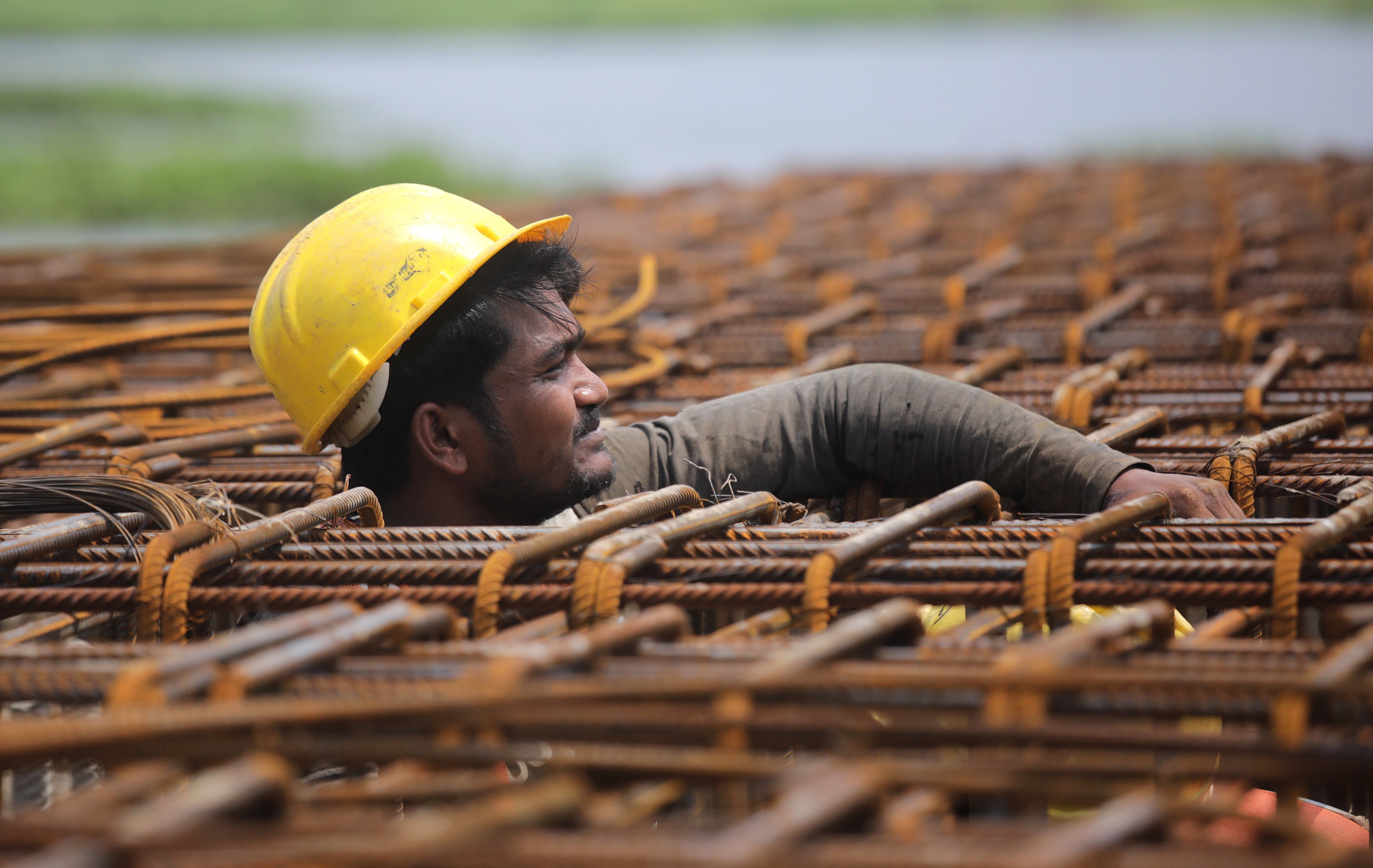 A labourer works on a construction site near Kolkata, India, on May 2. Some two-thirds of all workers in the Asia-Pacific region are employed informally, often on low wages, in hazardous conditions and without a contract. Photo: EPA-EFE
