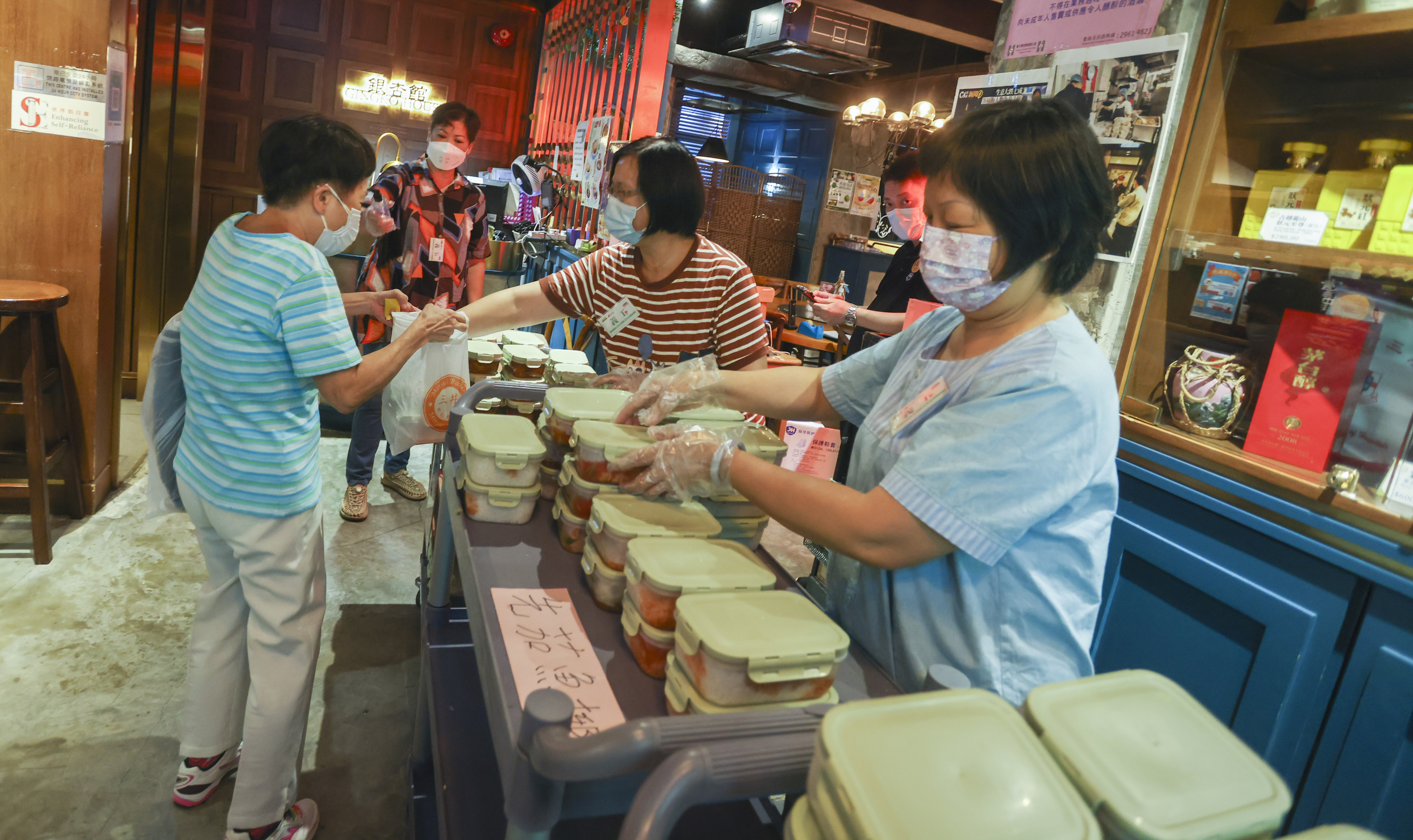 Gingko House’s Love Project Rice Box team in Yau Ma Tei on August 1. Photo: Jonathan Wong