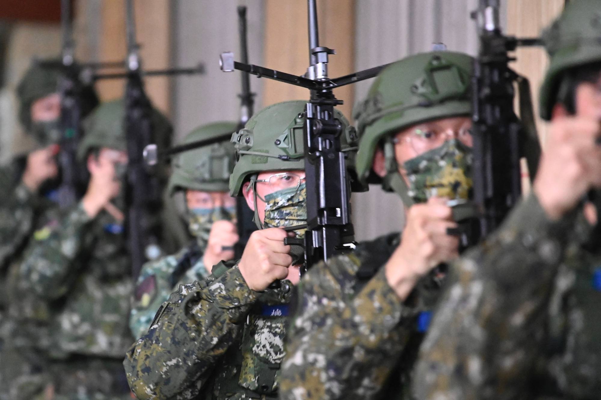 Taiwan reservists take part in a military training at a military base in Taoyuan on March 12, 2022. Photo: AFP