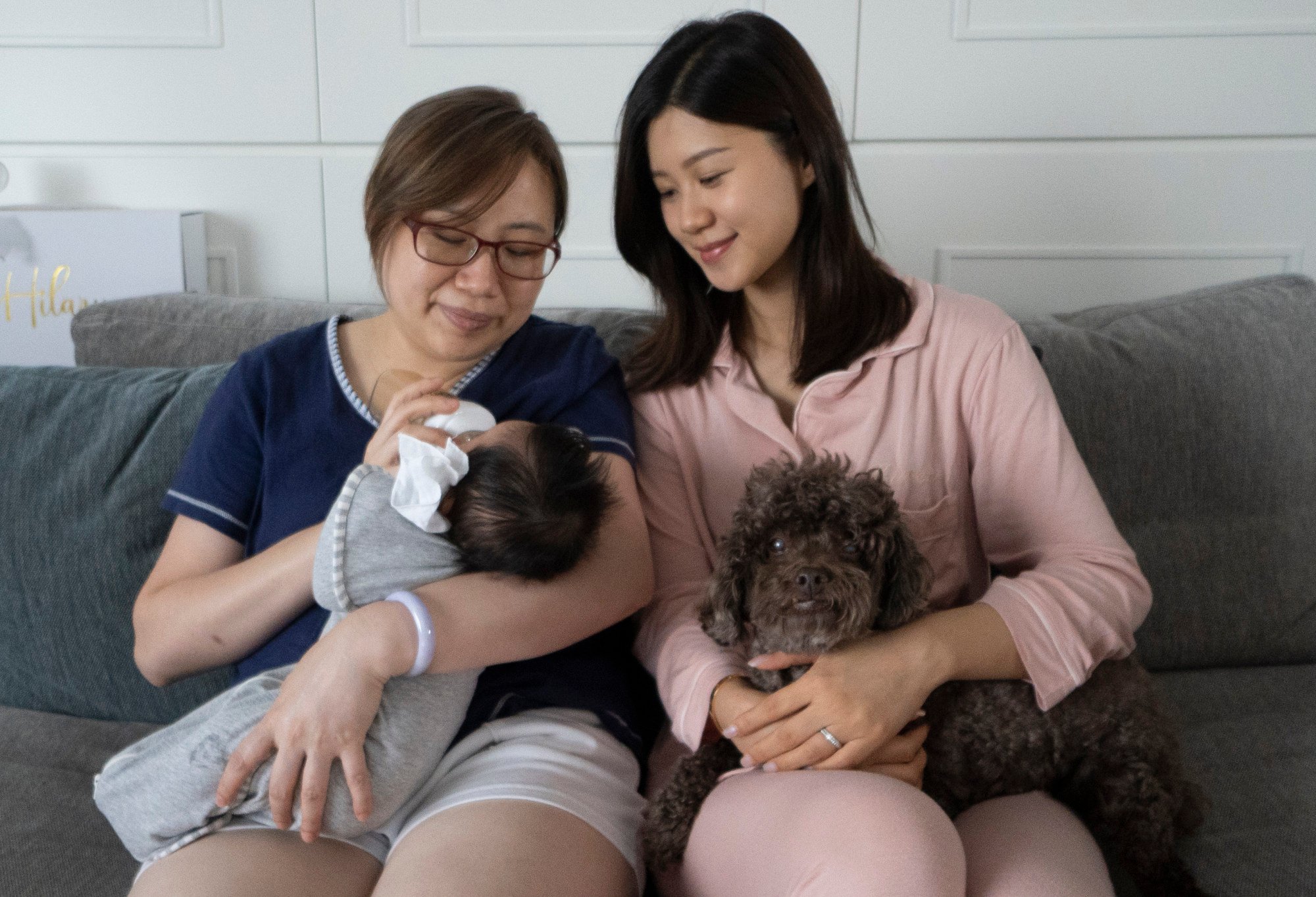 Chan looks after new mother Karen Lai (right) and her baby. Photo: SCMP/Danai Howard
