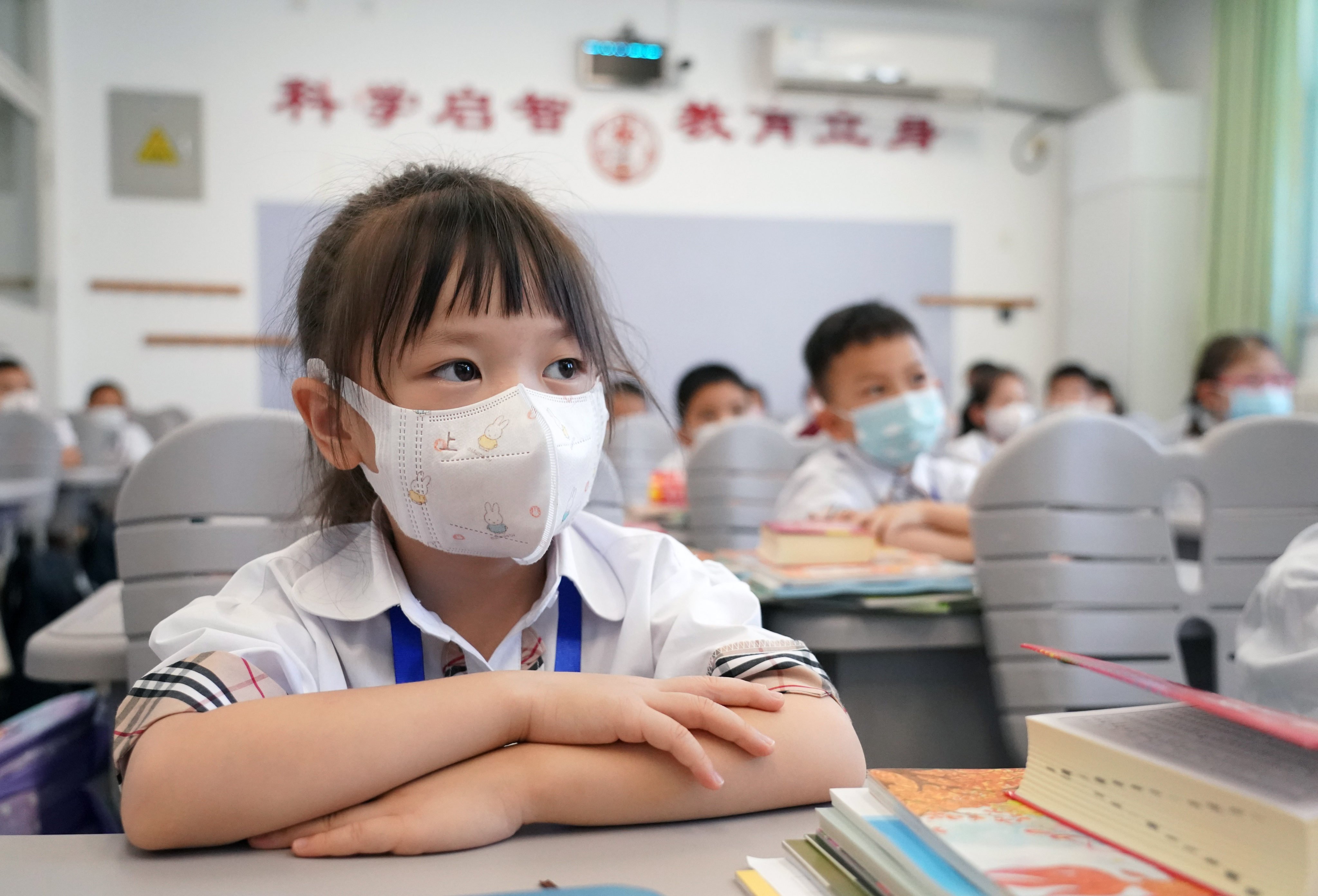 At Zhongguancun No 1 Primary School in Haidian district of Beijing, students attend class with masks. Photo: Xinhua