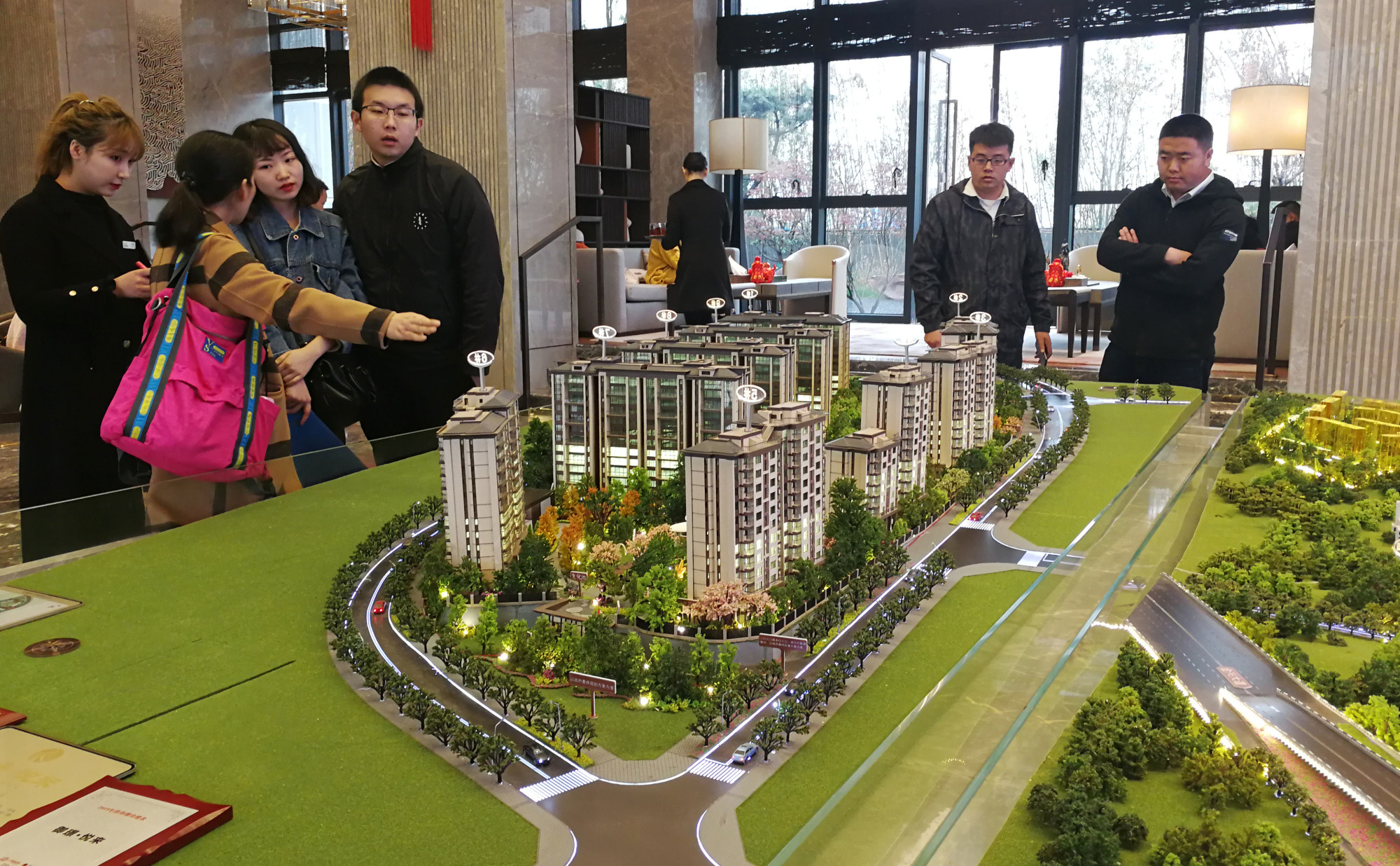 Homebuyers at the sales centre for a residential project in Chongqing in March 2019. Photo: Zheng Yangpeng