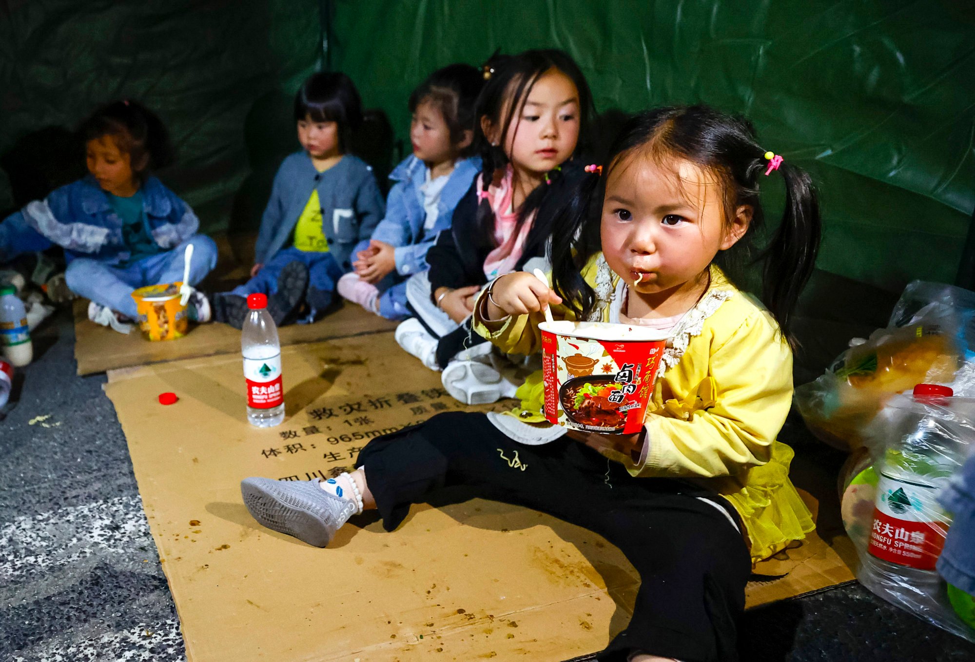 Evacuated children at a temporary shelter in Luding county. Photo: Xinhua