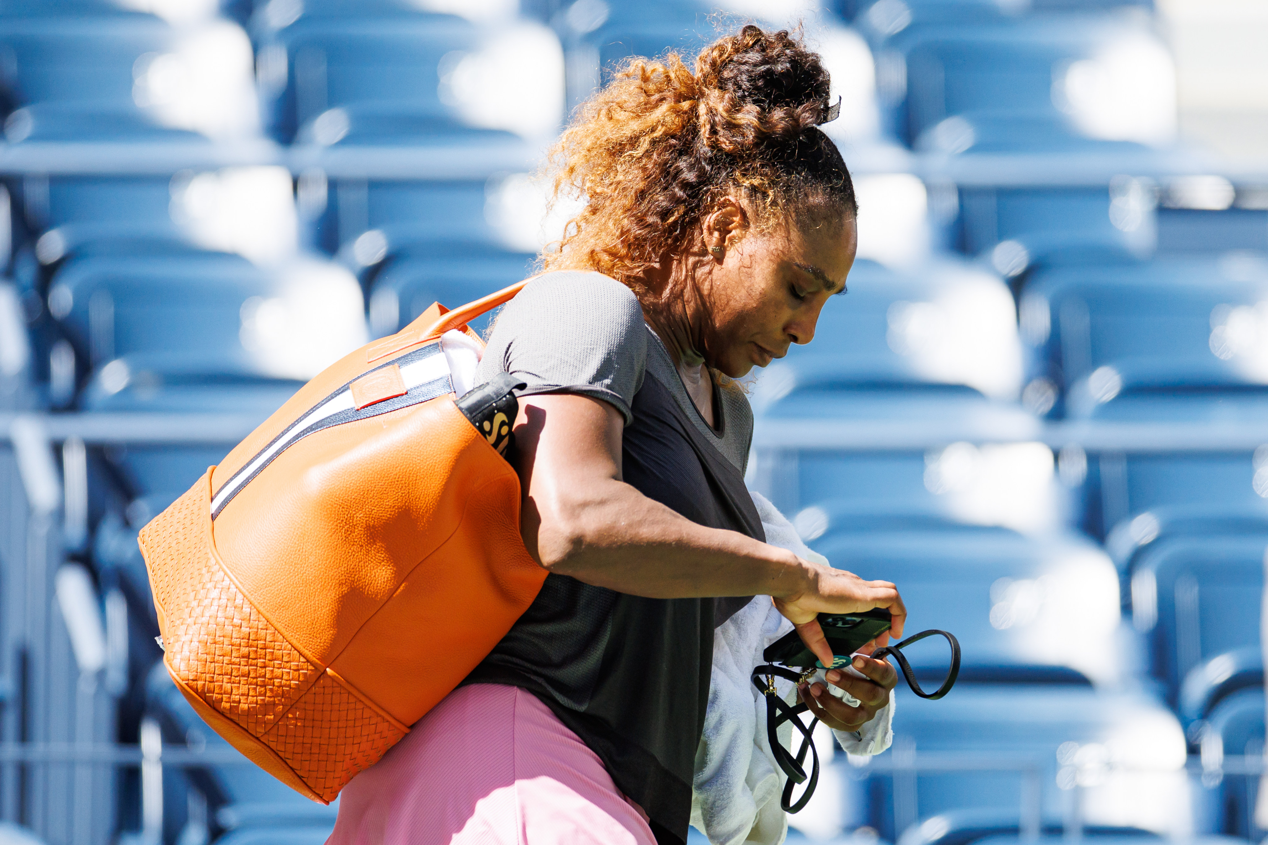 Women’s tennis legend Serena Williams turned heads at what may be her last US Open with a giant orange Niccolo bag from Italy-inspired designer Kimberly Pucci. Photo: TPN/Getty Images