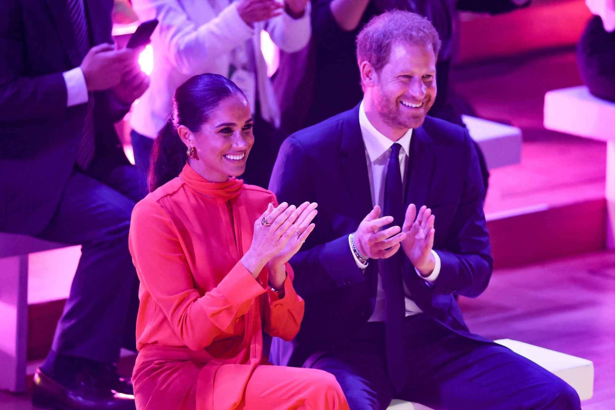 Meghan, Duchess of Sussex, and Prince Harry, Duke of Sussex, clapping during the opening ceremony of the One Young World Summit 2022 at The Bridgewater Hall on September 5, in Manchester, England. Photo: Getty Images