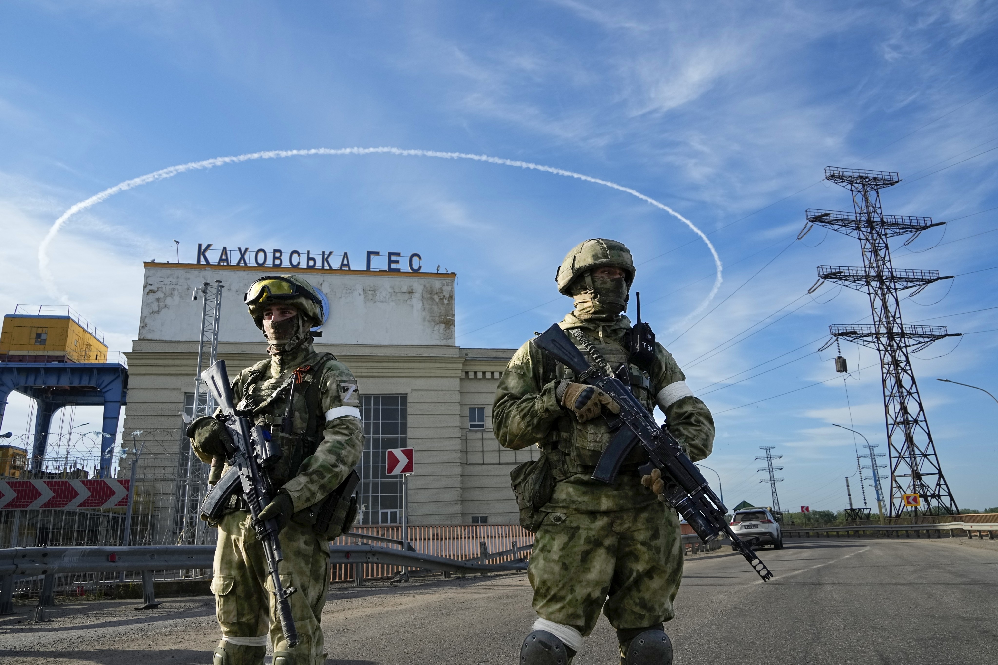 Russian troops guard the Kakhovka hydroelectric station, in Kherson, south Ukraine, on May 20. According to Russian state TV, the future of the Ukrainian regions occupied by Moscow’s forces is all but decided. Photo: AP