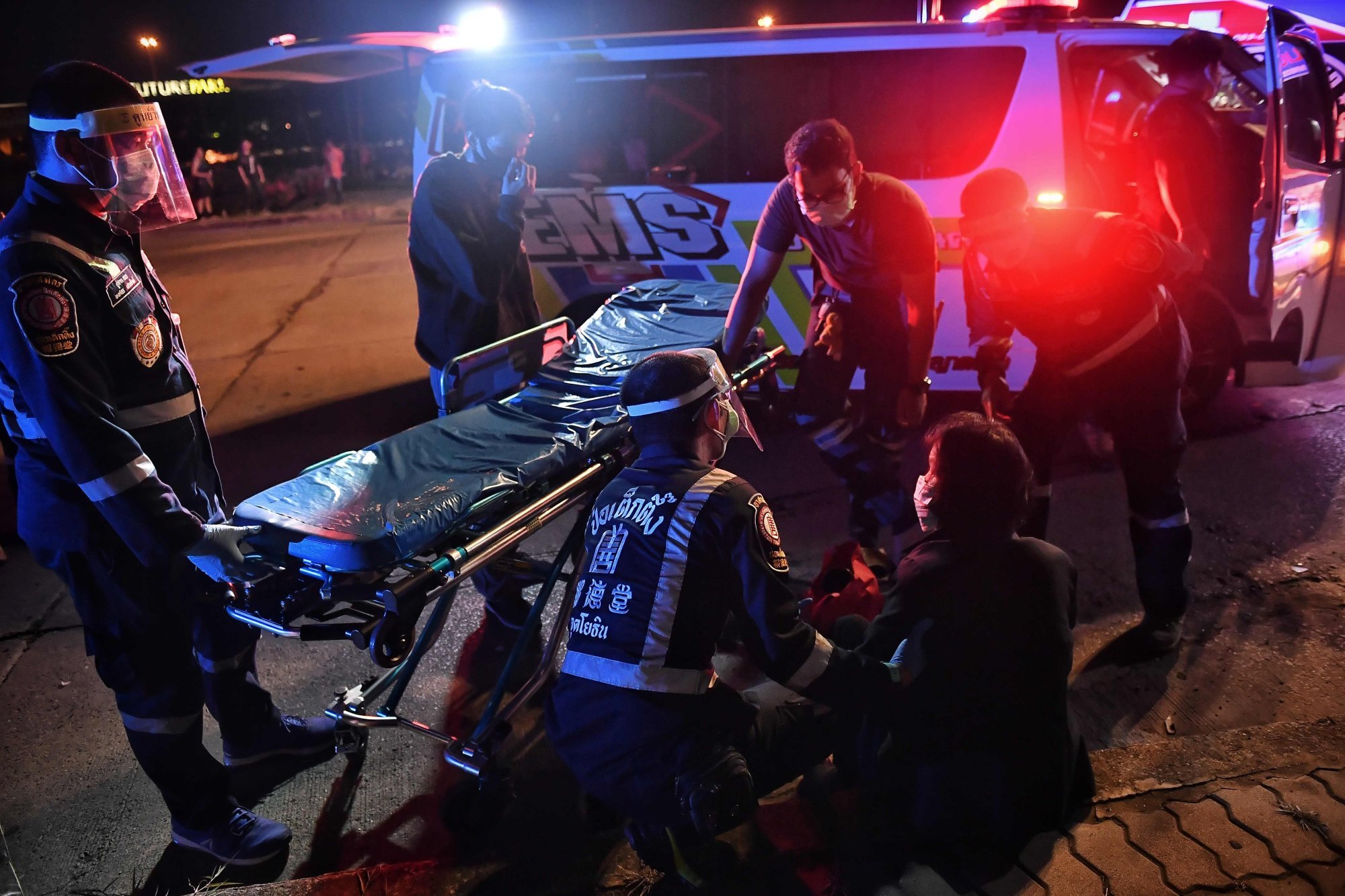 Volunteer rescuers treat a woman at the scene of a road accident near Bangkok in 2020. Thailand’s roads were named as the deadliest in Southeast Asia by the World Health Organization in 2018. Photo: AFP
