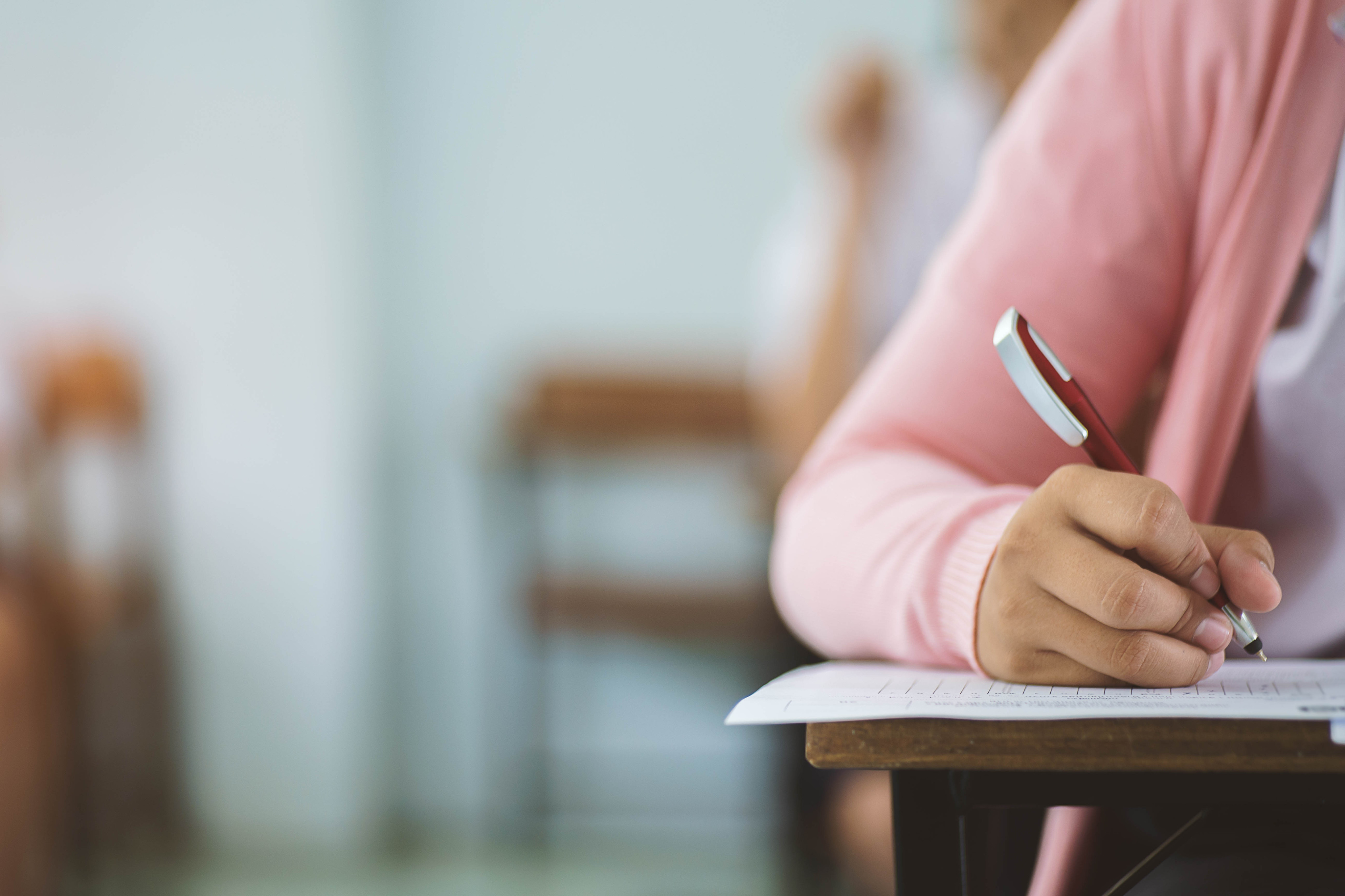 Student writing. Экзамен Сток. Writing Exam. Ребенок записывает. Shutterstock школа.