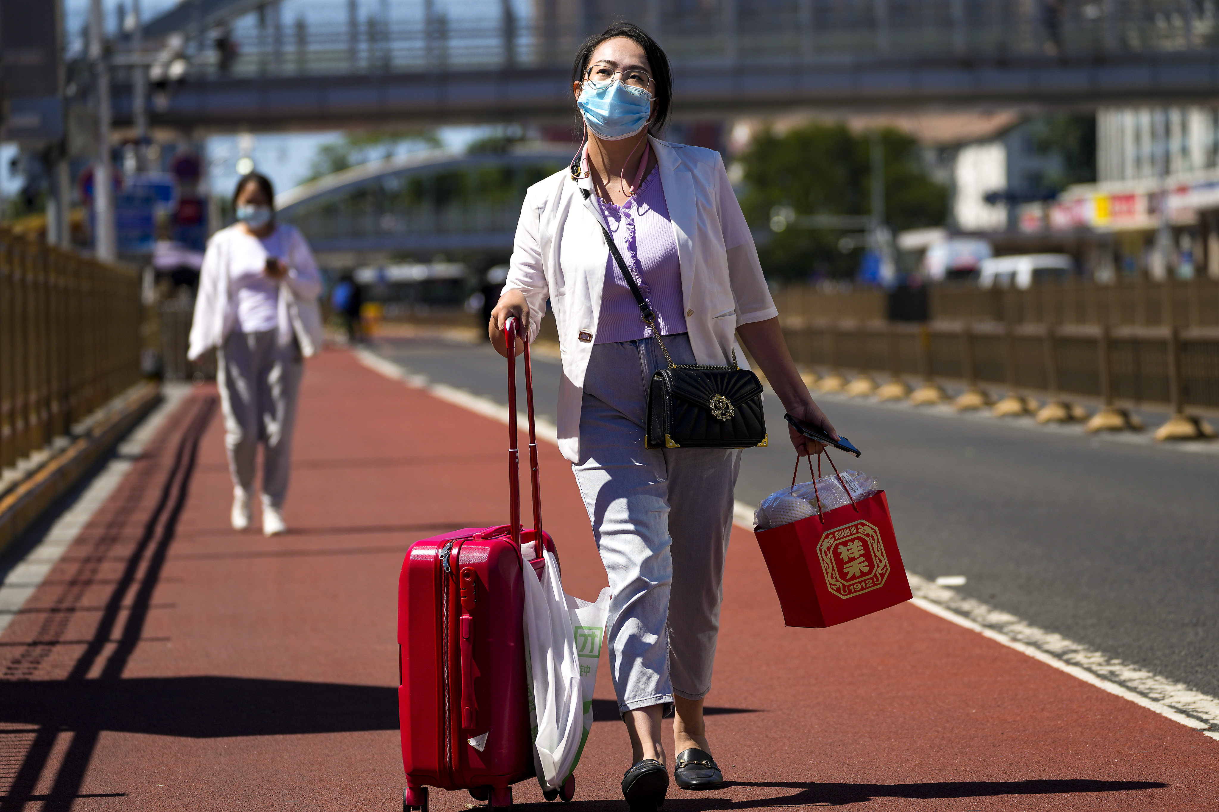 China is discouraging domestic travel from Saturday until the end of October – a period that covers the Mid-Autumn Festival, National Day holiday and the Communist Party congress. Photo: AP