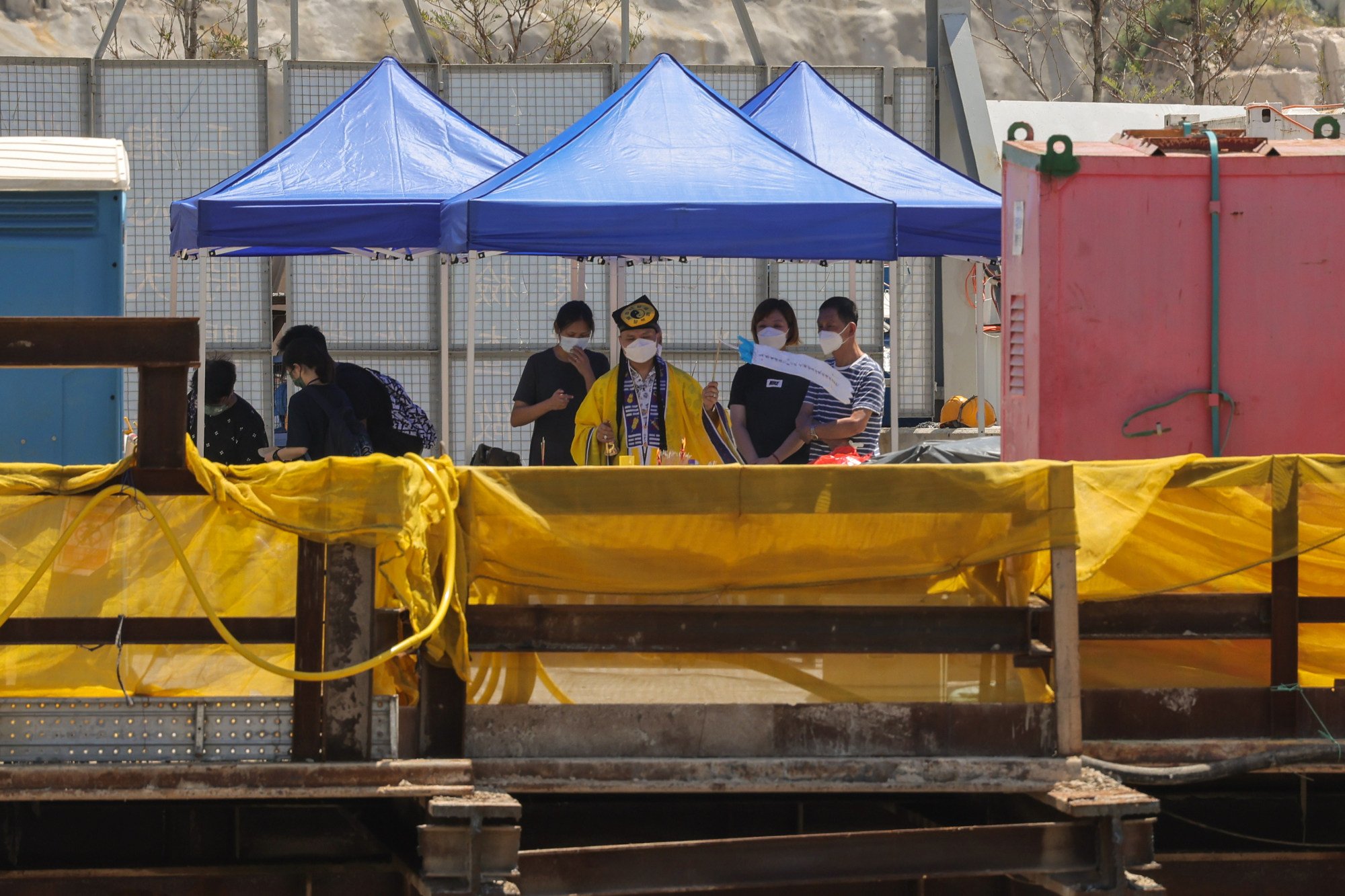A ritual being conducted at the site for one of the dead victims. Photo: Jelly Tse