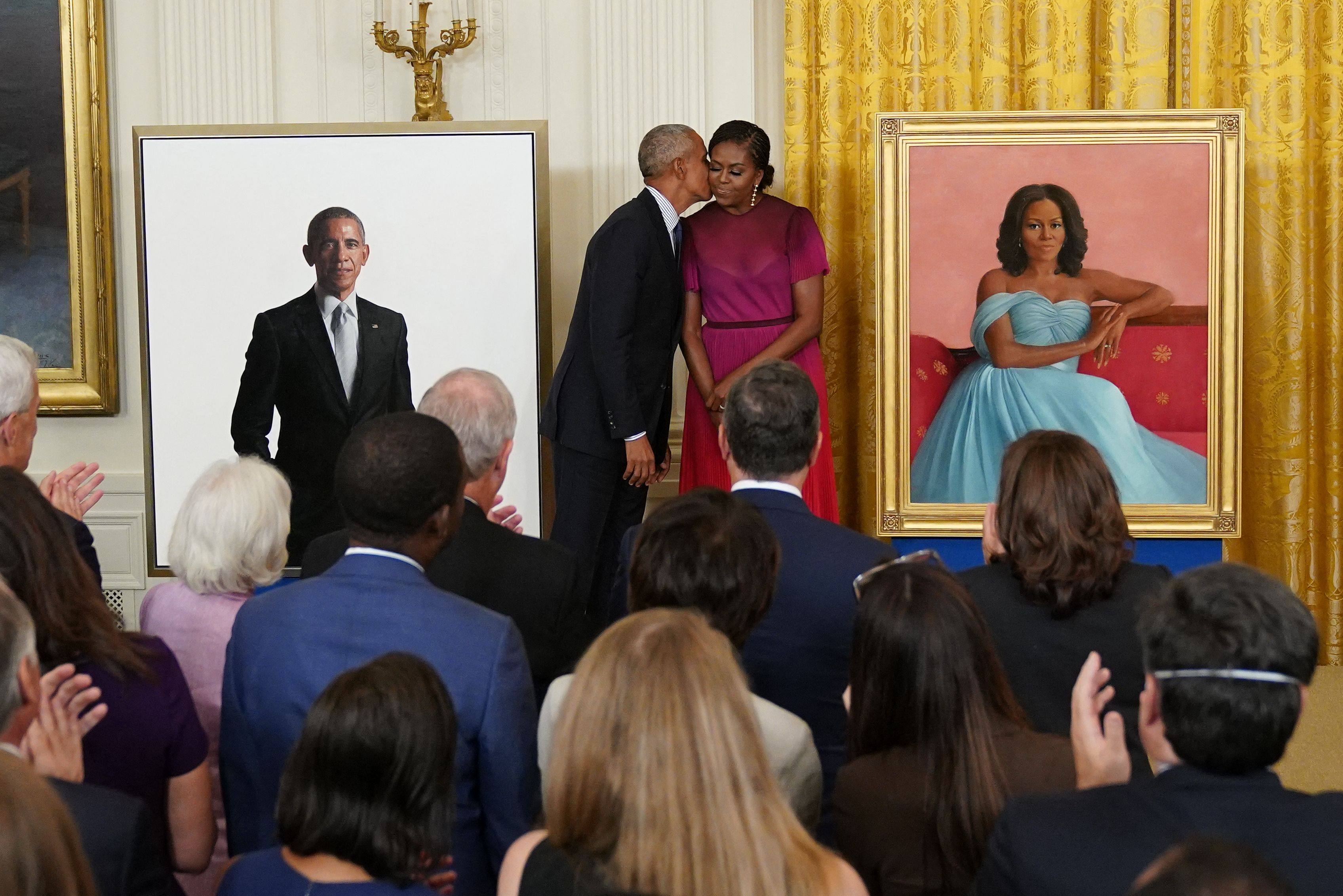 Former US president Barack Obama kisses his wife, Michelle Obama, during a ceremony to unveil their official White House portraits on Wednesday. Photo: AFP
