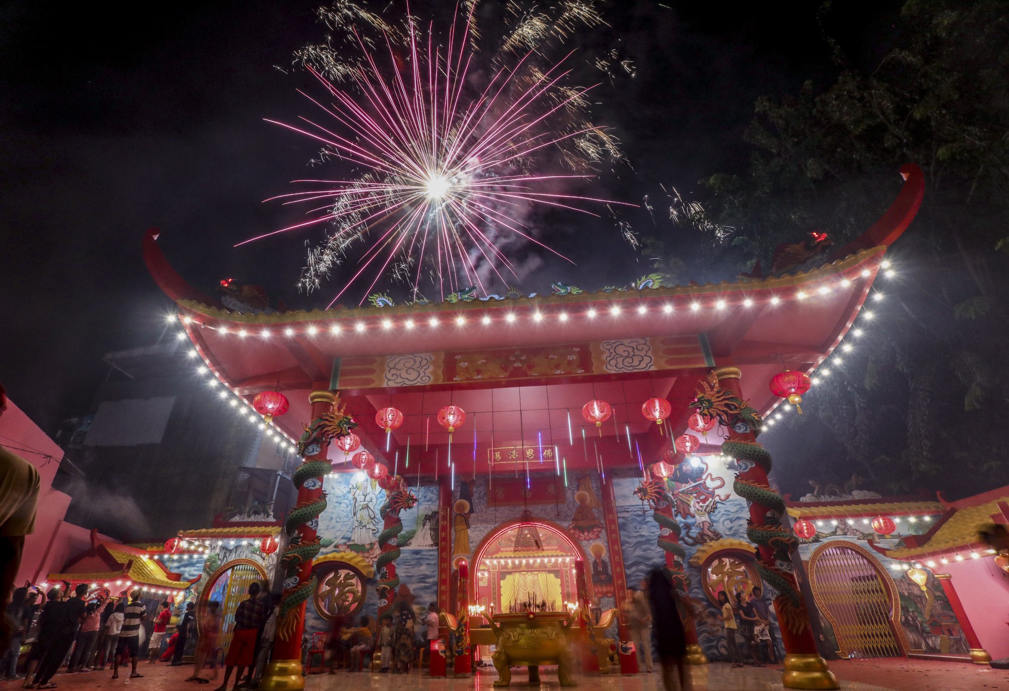 Fireworks light up the sky during the Lunar New Year eve celebrations at a temple in Medan, Indonesia, in January 2020. Photo: EPA-EFE
